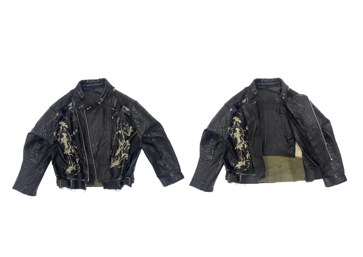 Black leather jacket with floral designs on front and an open view showing interior