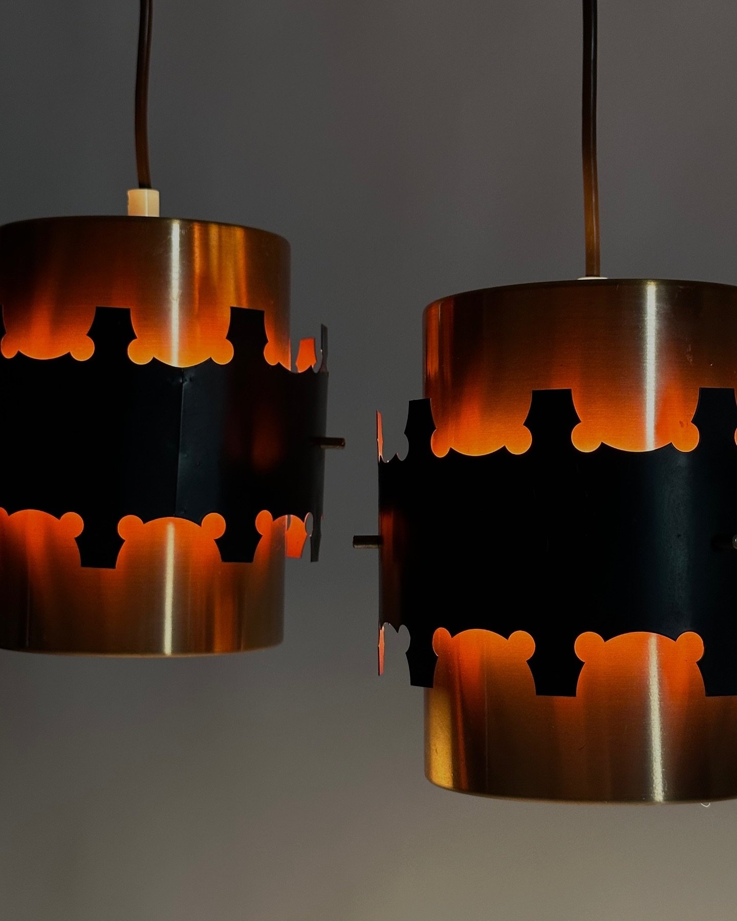 Set of two copper colored aluminum pendant lights by Coronell Electro Denmark, 1960s

18 &times; 18 cm. each
Copper colored aluminium and enamelled metal.
Condition is vintage with some traces of use such as scratches and small dents.
New wiring with