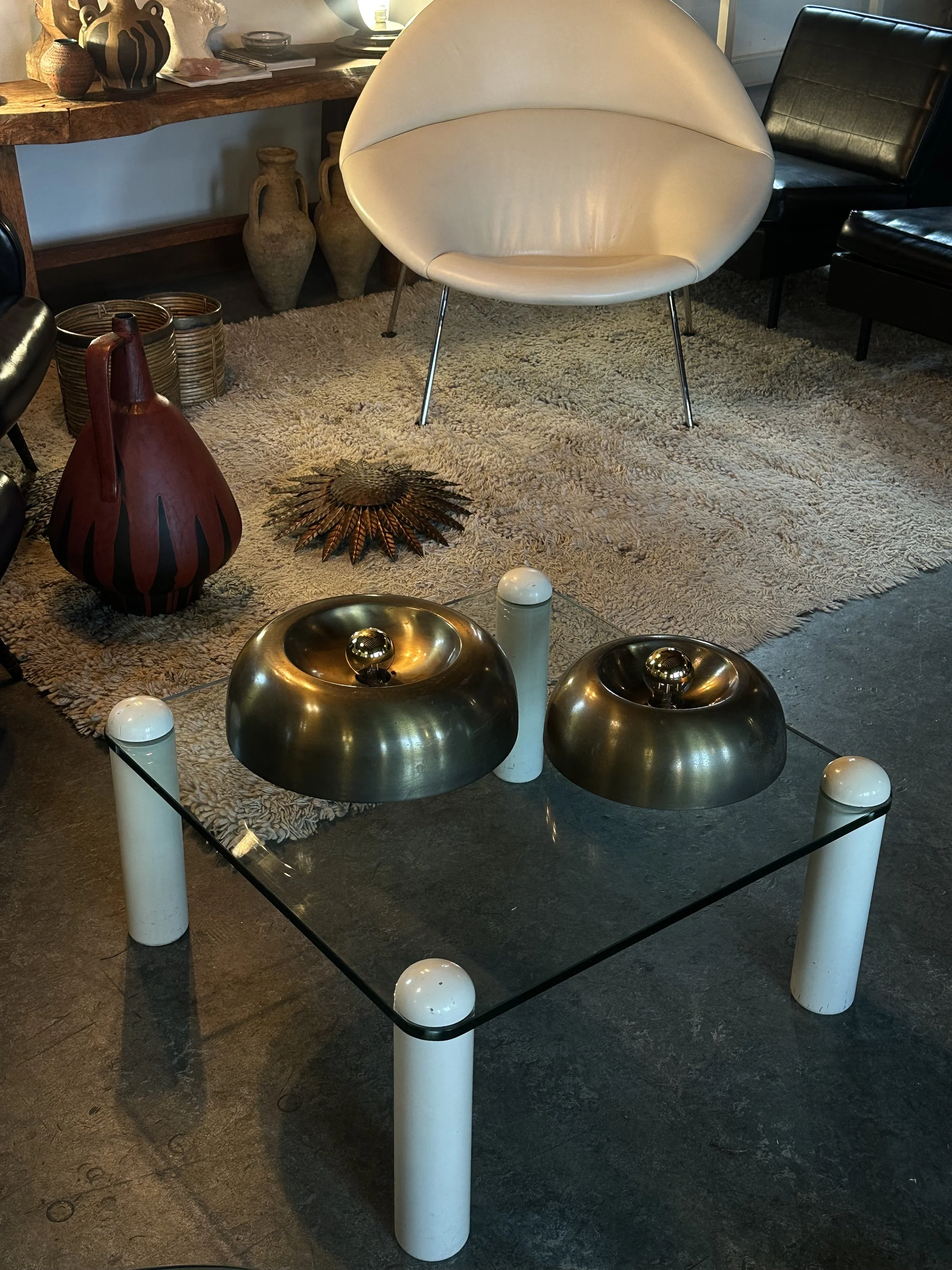 vintage brass lamps and mid century low glass table.jpeg