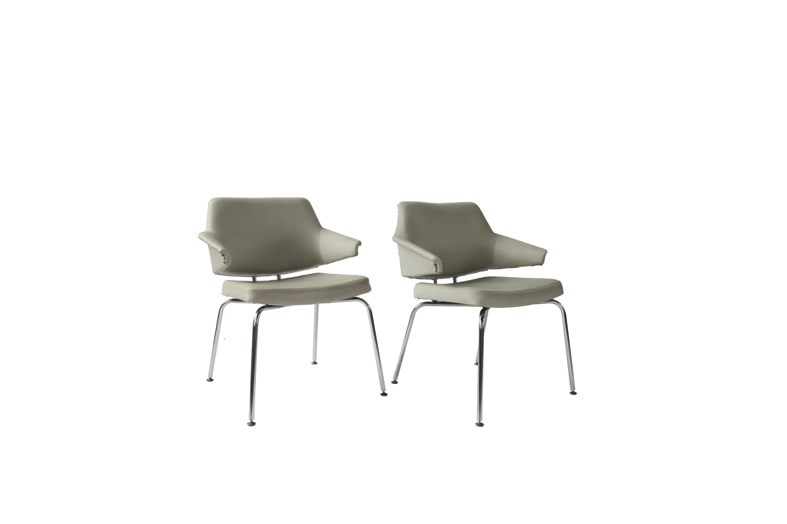 A pair of danish mid century leatherette chairs.jpg
