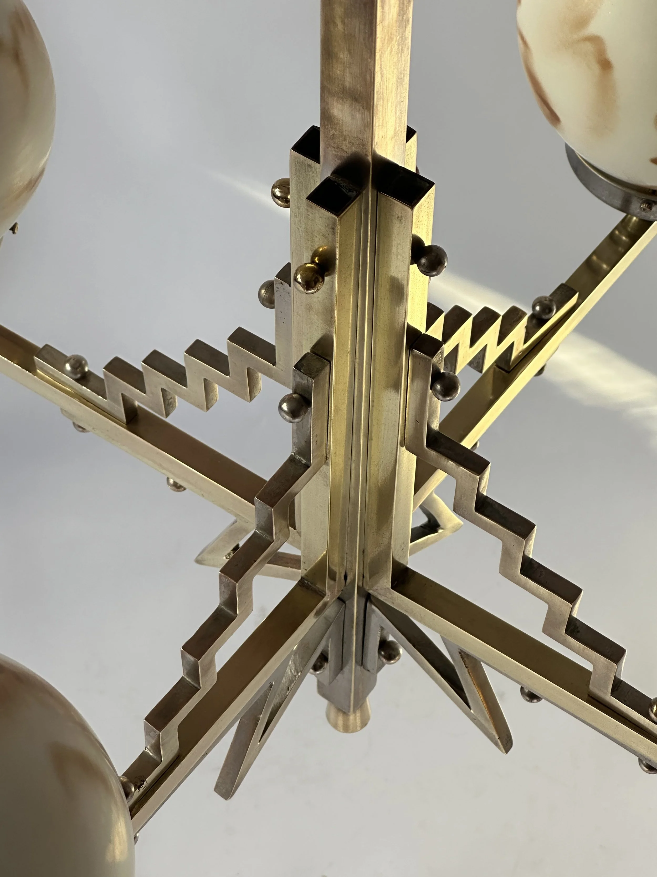 art deco chandelier in brass and nickel.jpg