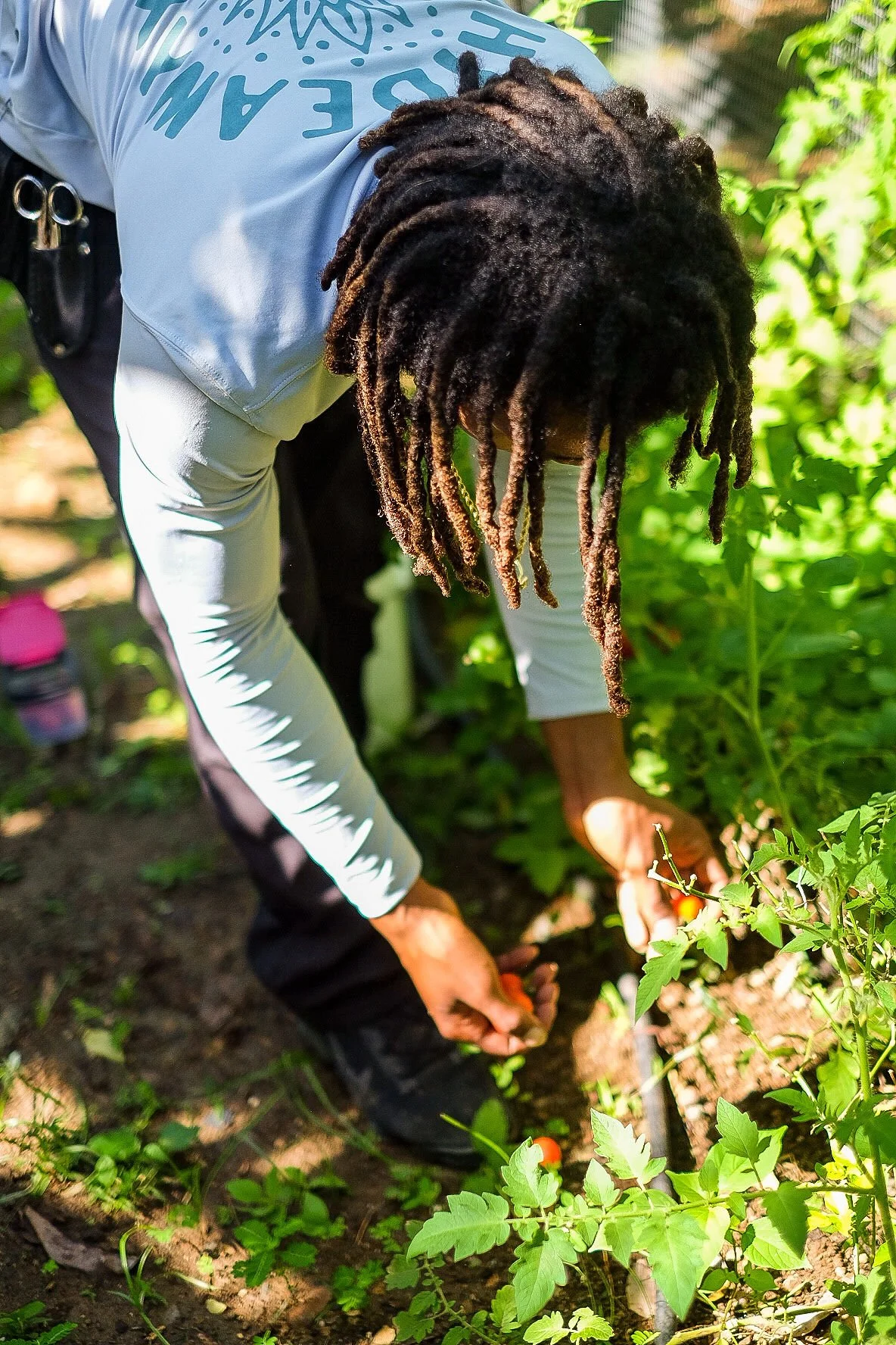 A farmer at The Hideaway tending crops