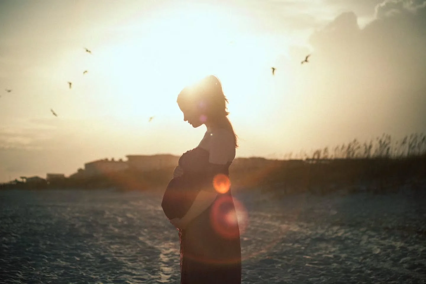 Beach sunsets and maternity photos are the perfect pairing.

We made a quick trip to the white sand beaches of Destin, Florida for the Rhine family, and the sky didn't disappoint. The water was perfect, the soon-to-be big brother was all about it, an