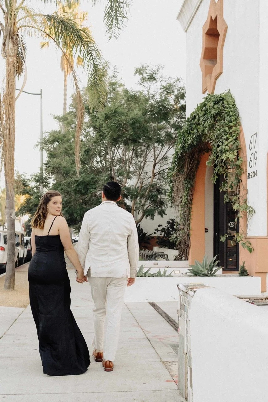 bride and groom walk to their portrait location on their wedding day