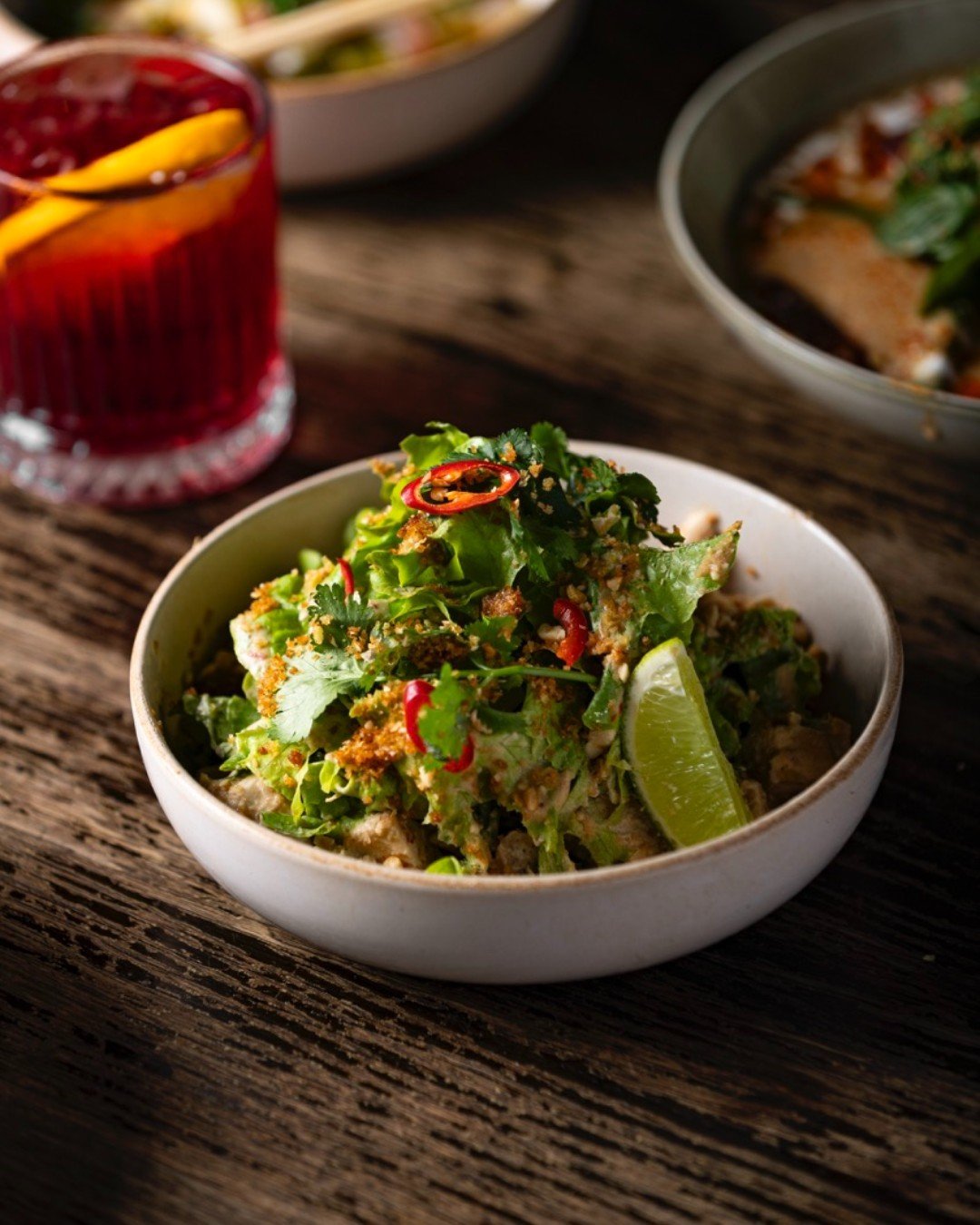 We can't get enough of our Coconut Chicken Salad 🥥 🐓

Indulge in tender poached chicken, oak leafs, kaffir lime, topped with roasted peanuts, coriander, coconut, and chilli 🌶️