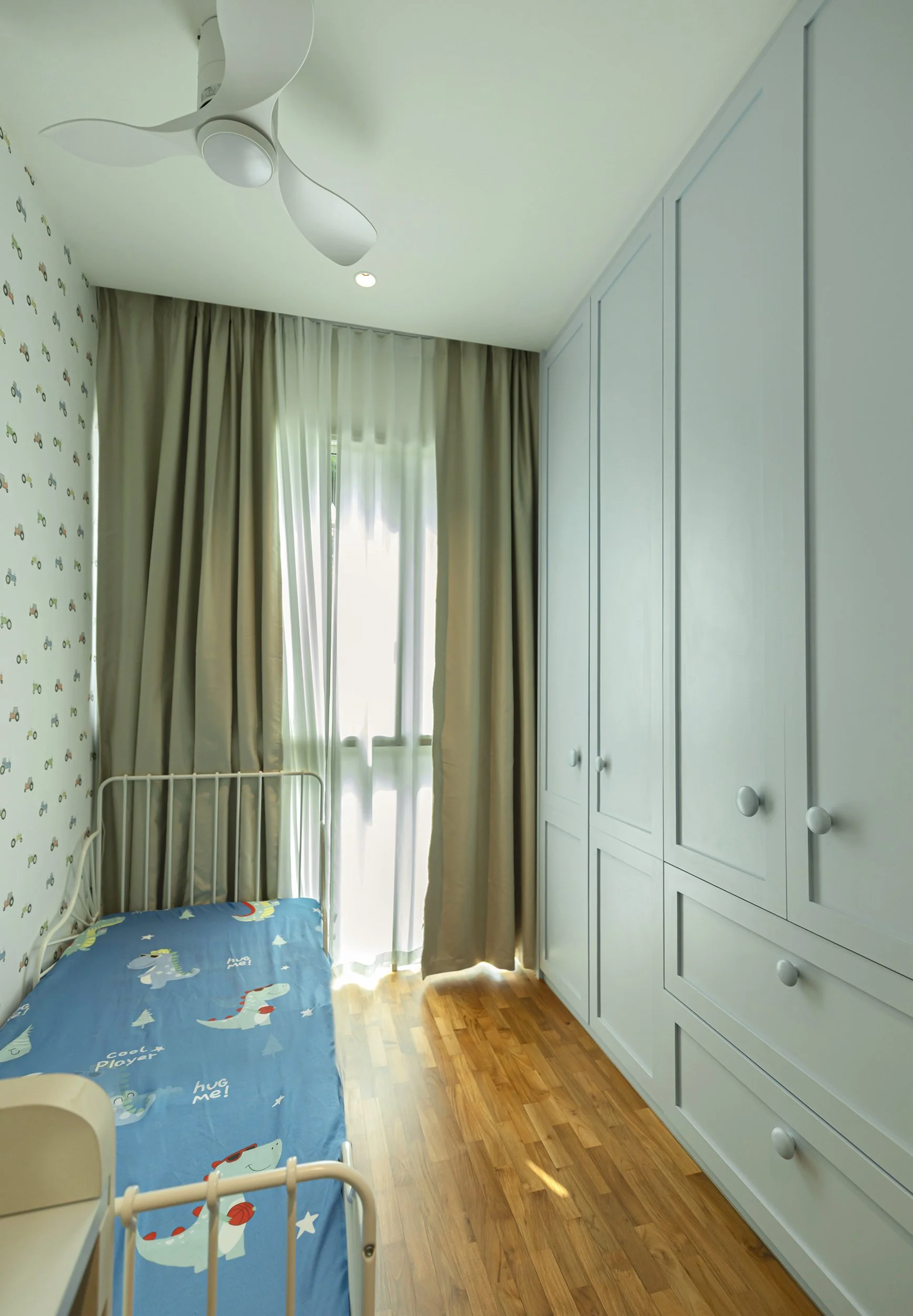 Son bedroom at Sunglade Condo Singapore designed with modern European concept, practical layout, soft tones and kid-friendly detailing