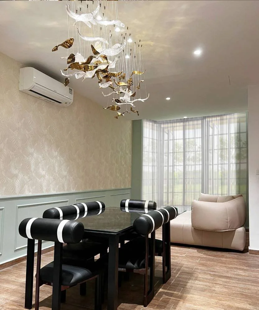 Living room at Hillcrest Bukit Timah with bold colours, modern Chinese and European fusion elements, layered textures and statement furniture
