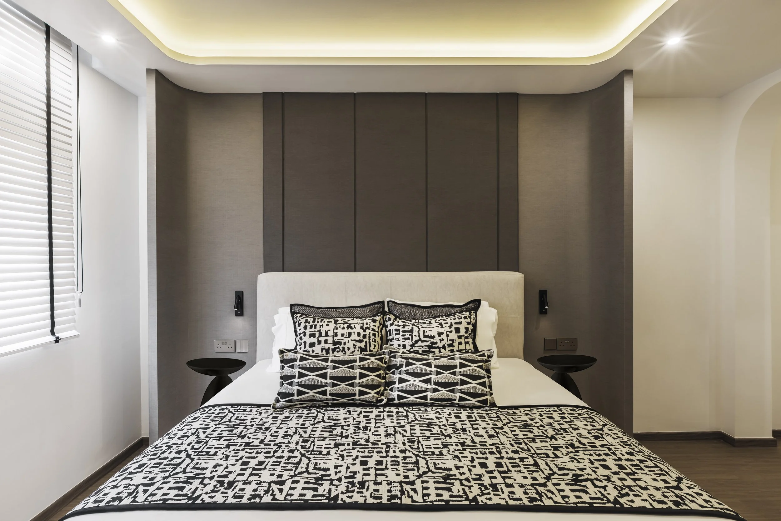 Luxury master bedroom in Sin Ming Bishan condo with modern European interior design, warm textures and refined detailing Singapore