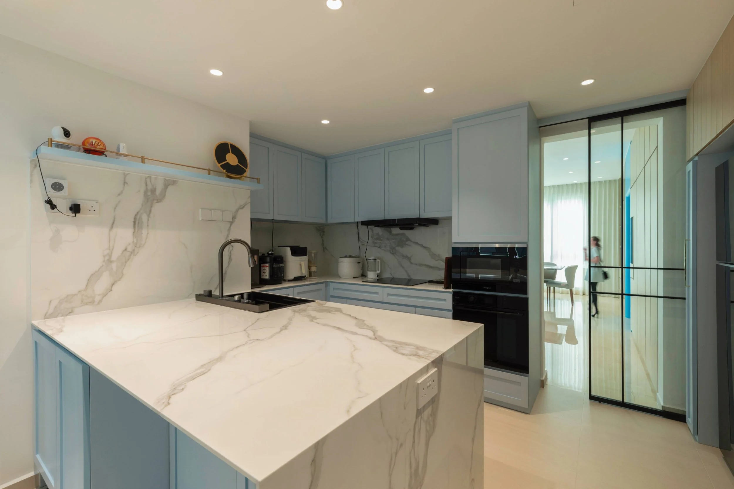 Coastal luxury kitchen at Caribbean Keppel Bay Singapore with soft tones, serene ambiance and sea-inspired interior design for restful living