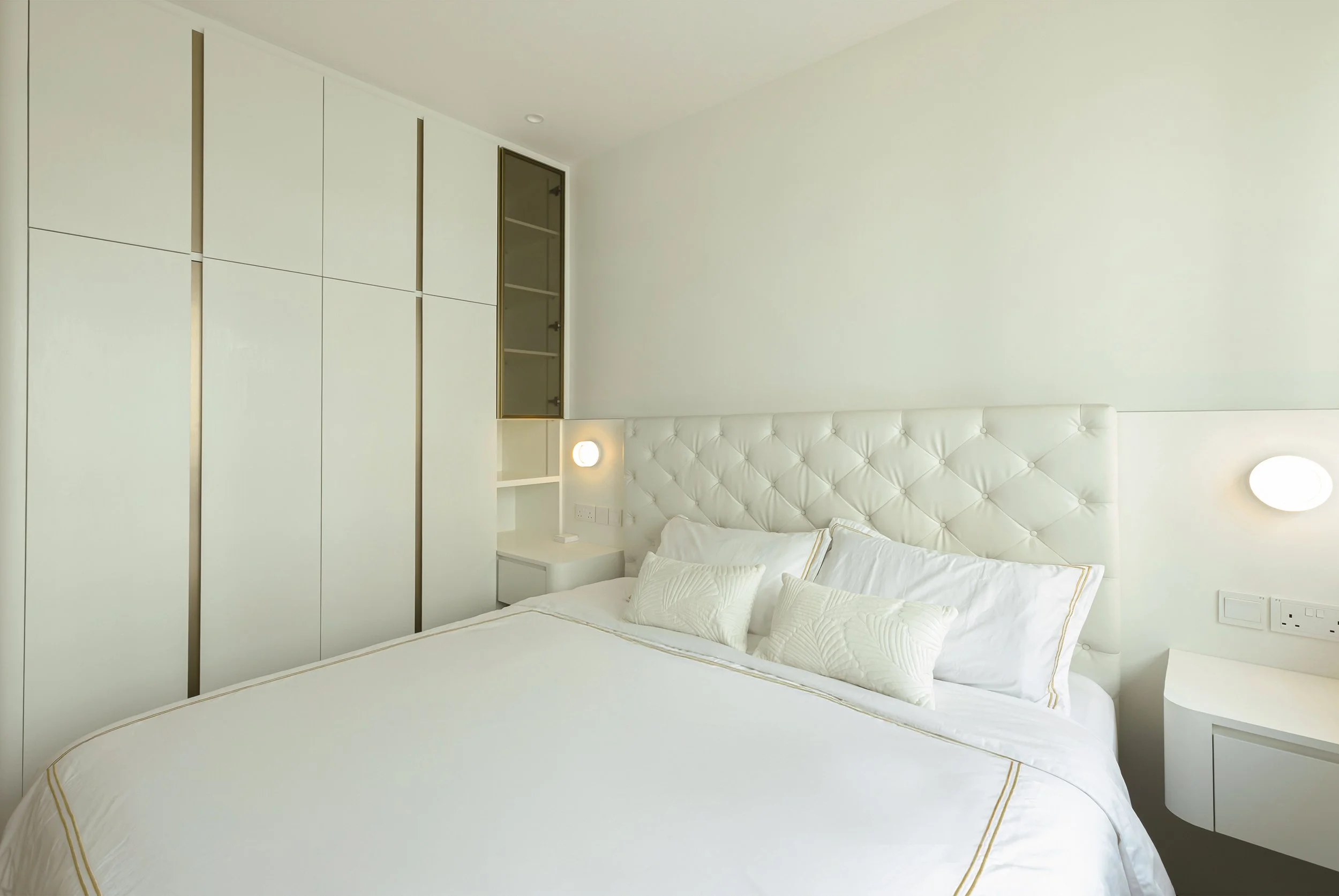 Luxury master bedroom at Sunglade Condo Singapore designed with modern European concept, soft colour palette and bespoke wardrobe carpentry
