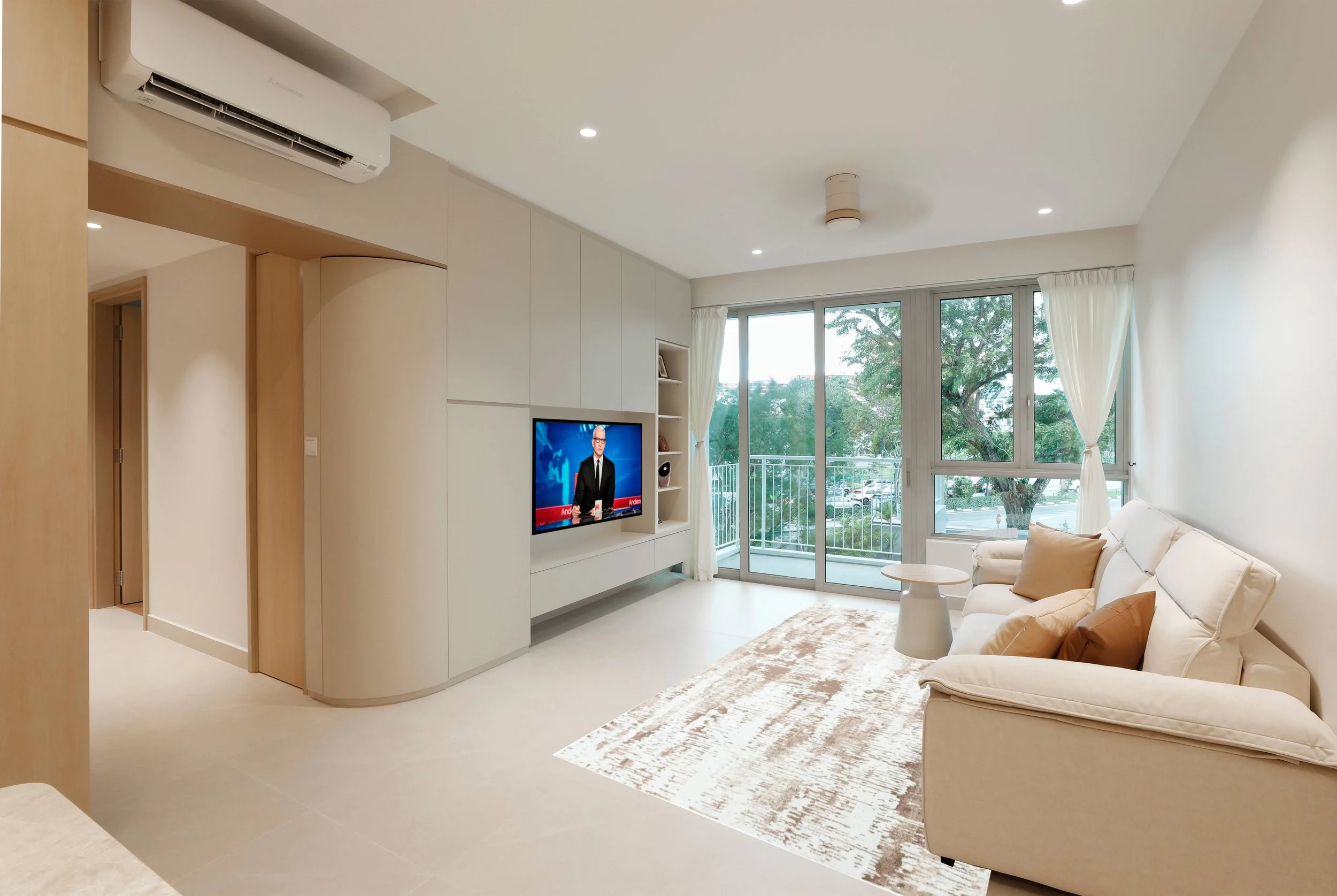 MUJI-inspired living space in Kovan Singapore featuring custom carpentry, light wood finishes and calm modern minimalist interior styling