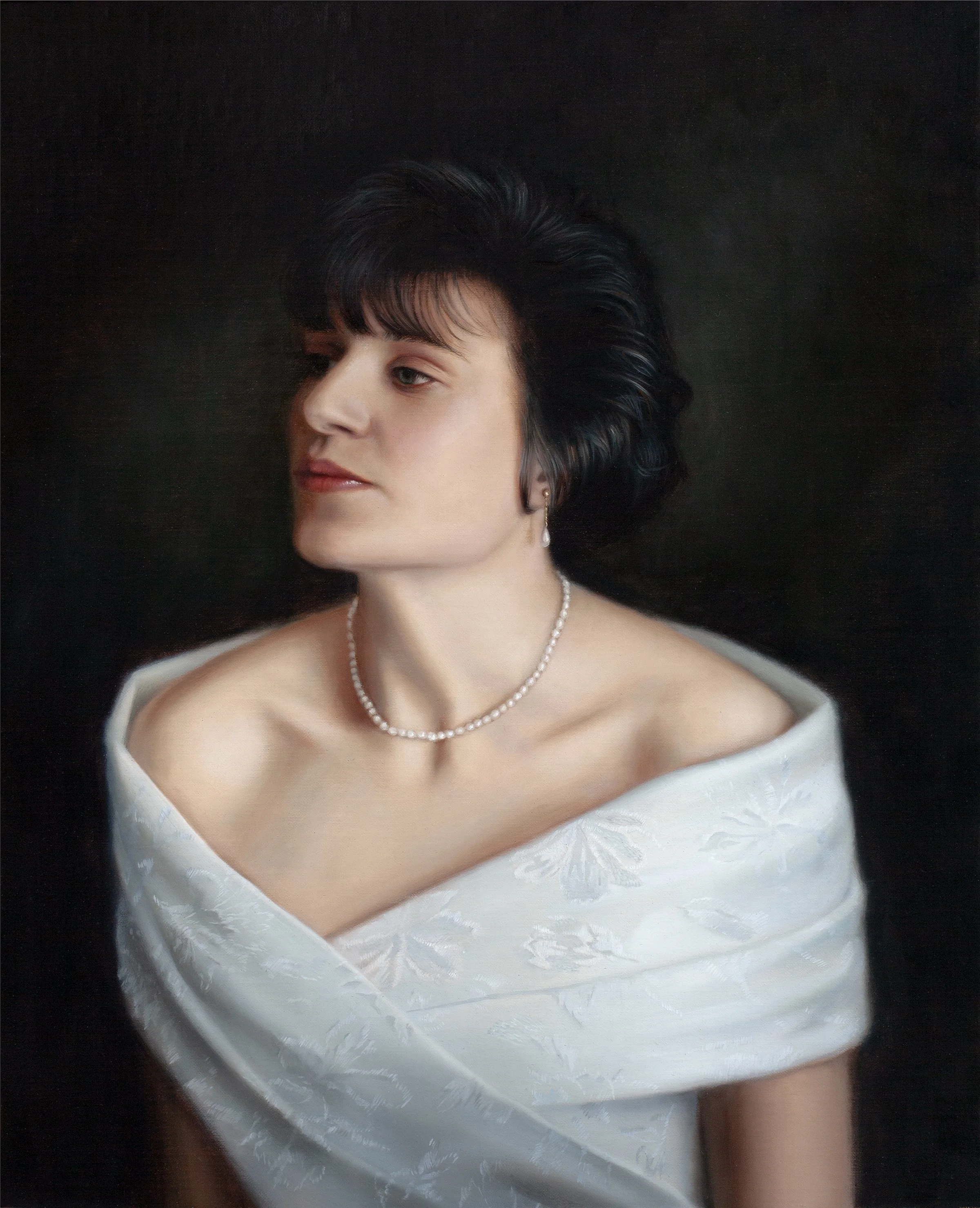Oil portrait of a woman wearing a white wrap and pearl necklace by Tina Spratt