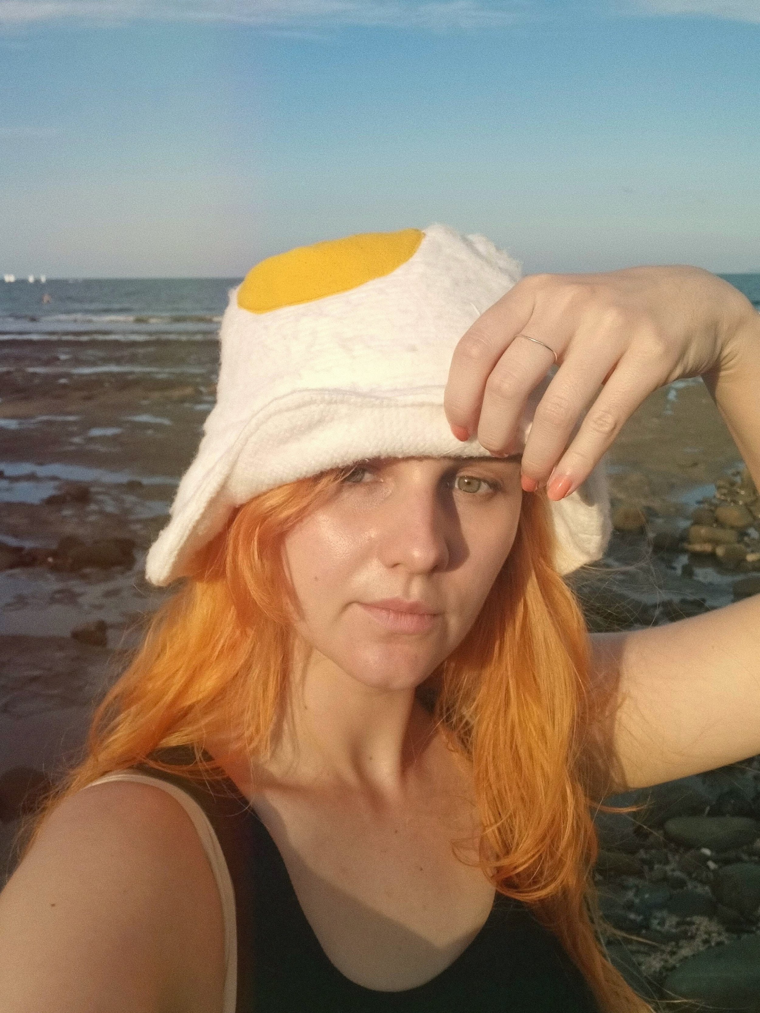 FRIED EGG BUCKET HAT AT TEH BEACH.jpeg