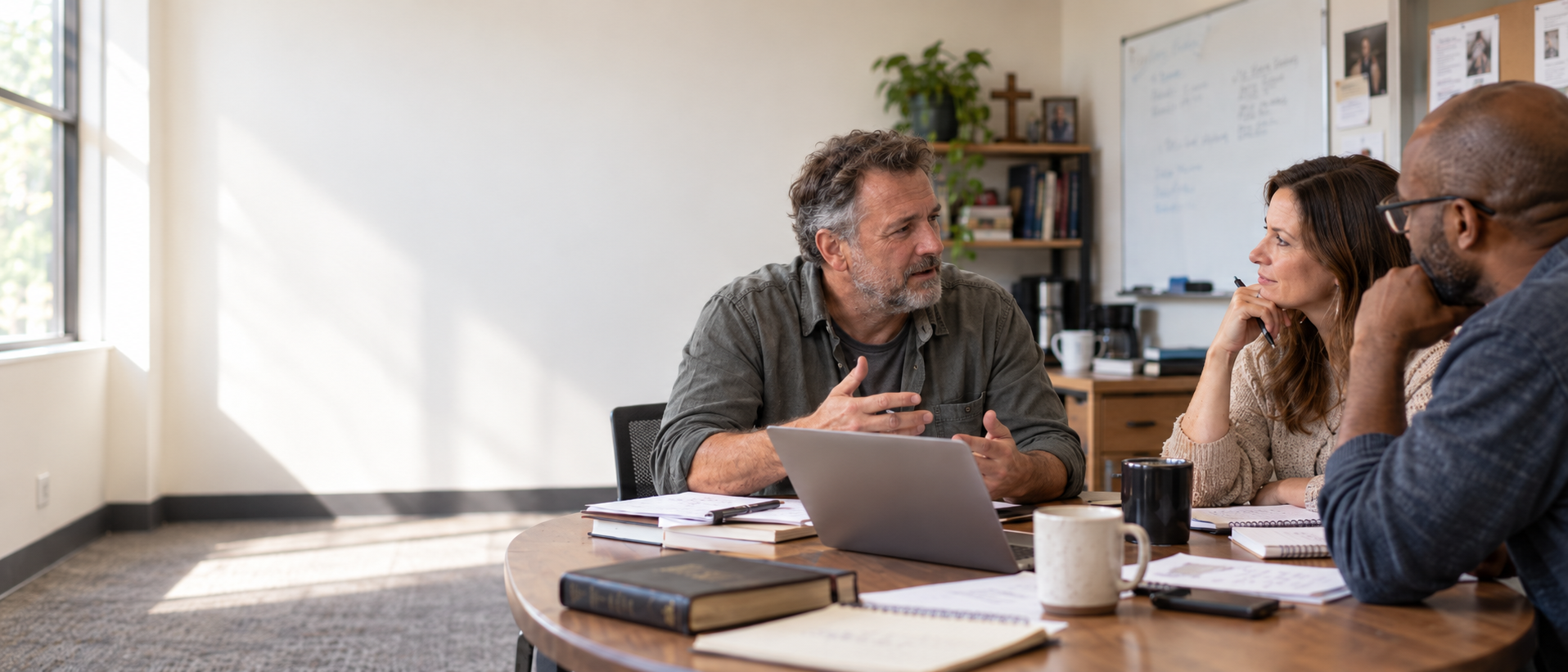 Pastoral Planning Meeting in Sunlit Office.png