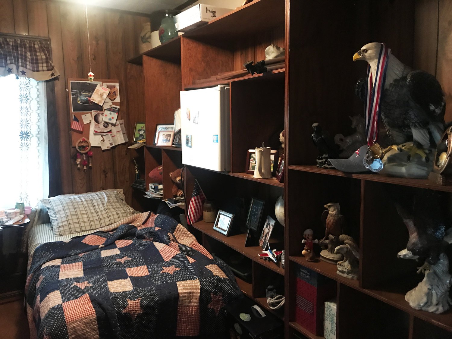 The bedroom is stuck in the past and continues the patriotic theme. it is a space that holds many childhood memories and offers an opportunity for the audience to glimpse at the man the male lead character once was.