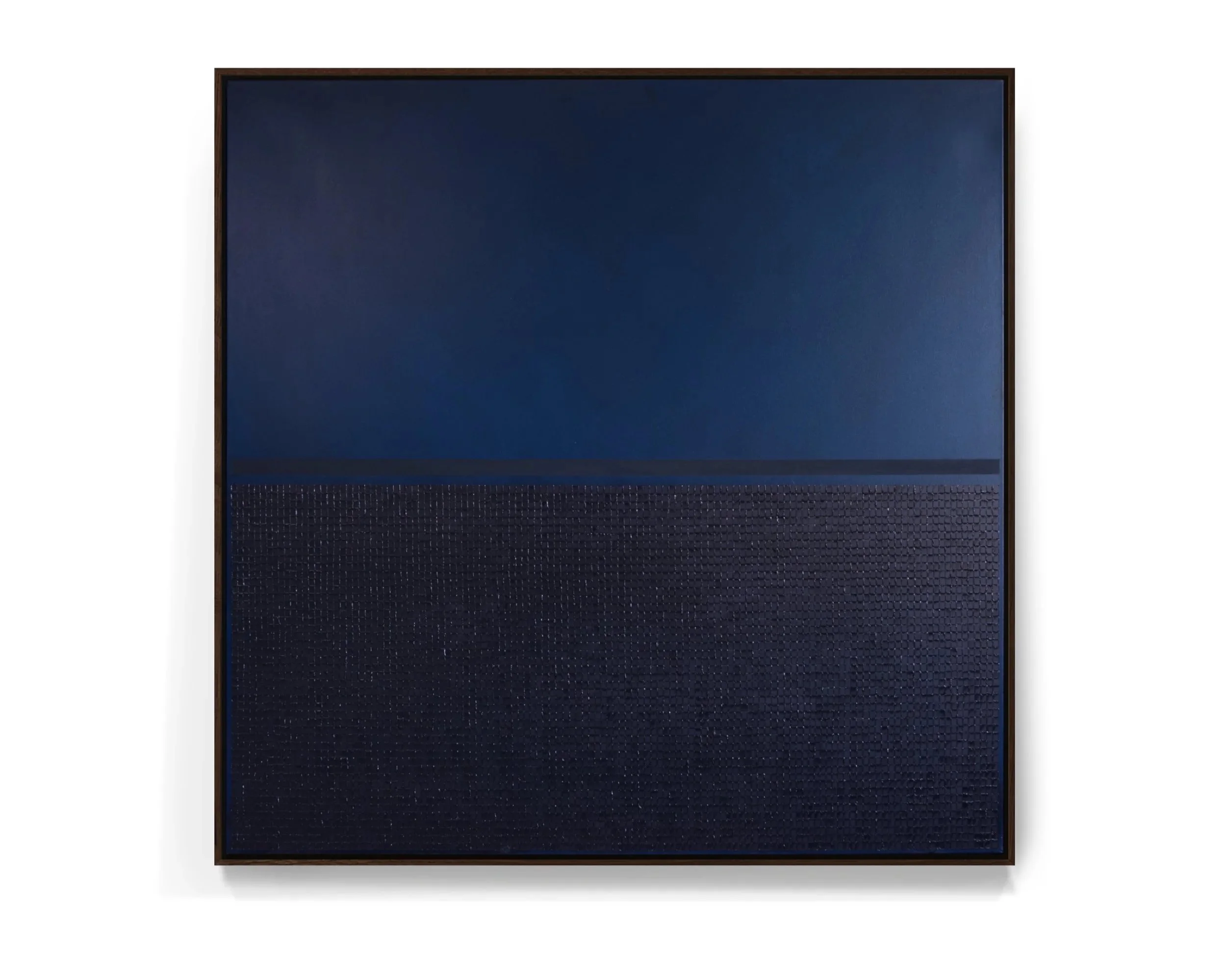 Minimalist square artwork with dark blue upper section and textured black lower section, framed in wood.