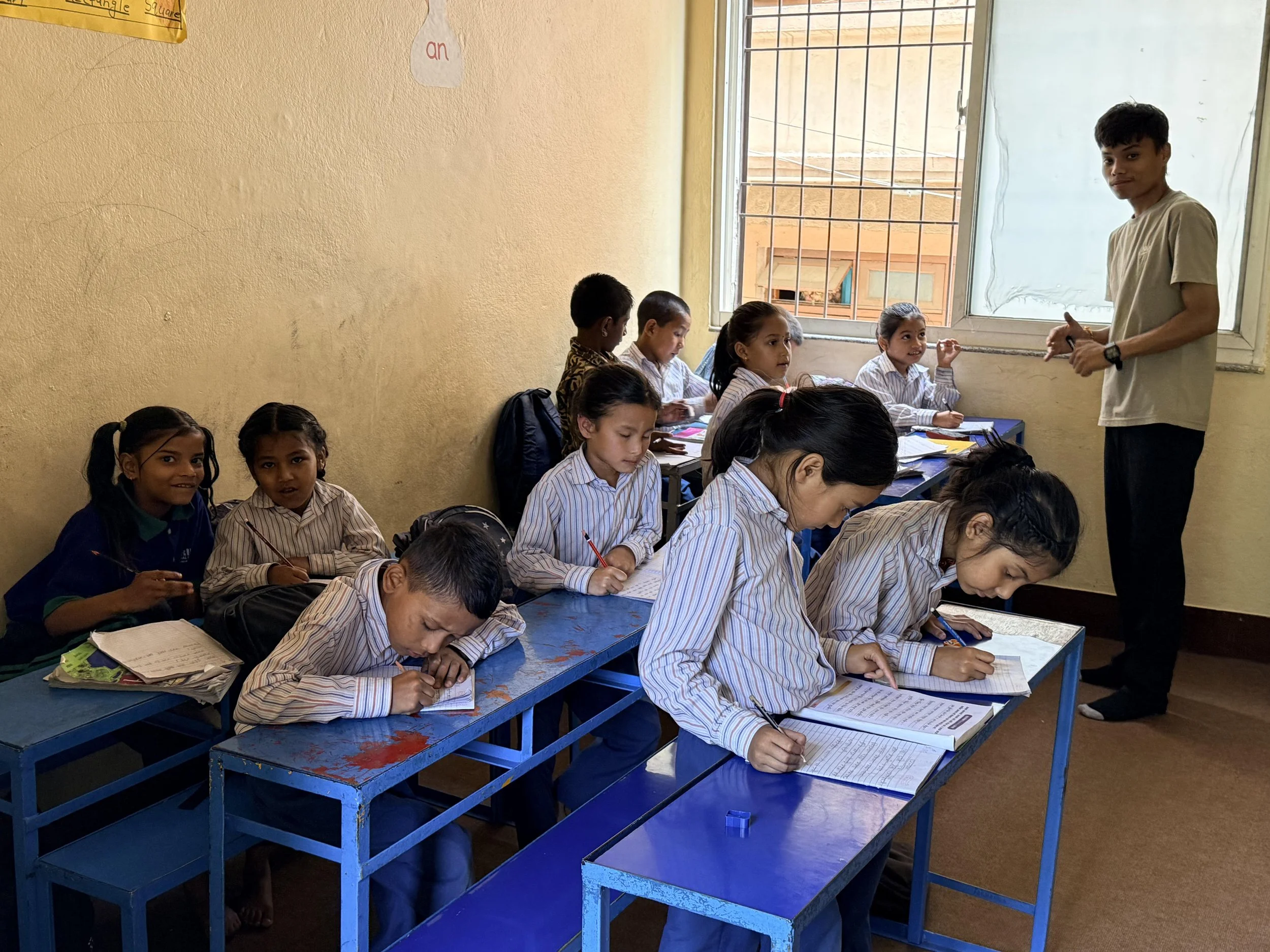 Post-SEE student helping young students at CC.jpg