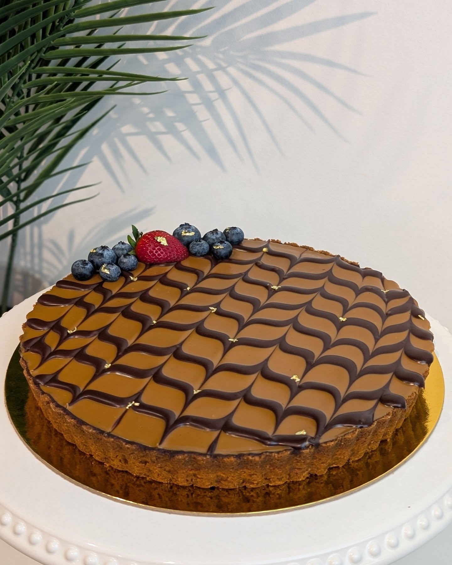 I adore making this tart &hearts;️ the crunch of the tart shell, smooth chocolate filling and creamy lotus cookie butter on top is magic in every bite. 
.
.
.
#tarts #dessertlover #lotusbiscoff #instafood #homemadetart #beautifuldesserts #instabaker 