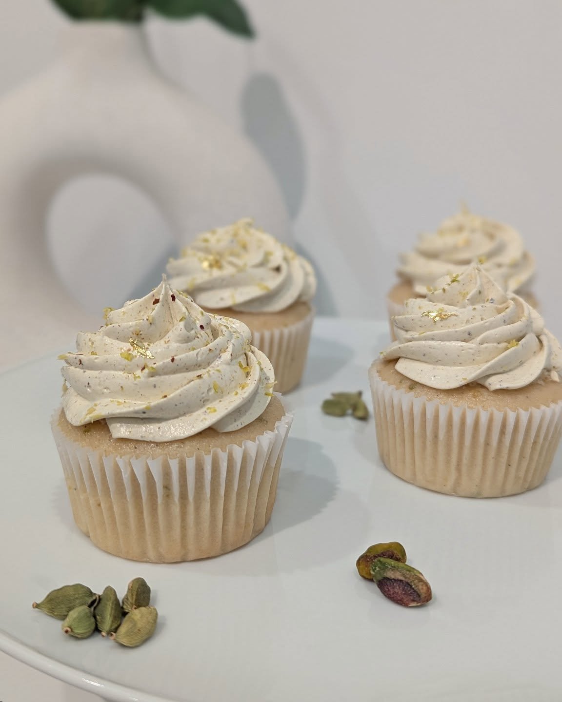 Isn't it amazing how food can transport you to a different time and place? Cardamom and pistachio, flavours of the east, every bite brings a richness to one's palate that's truly unmatched. These cupcakes take me back to my childhood summers, enjoyin