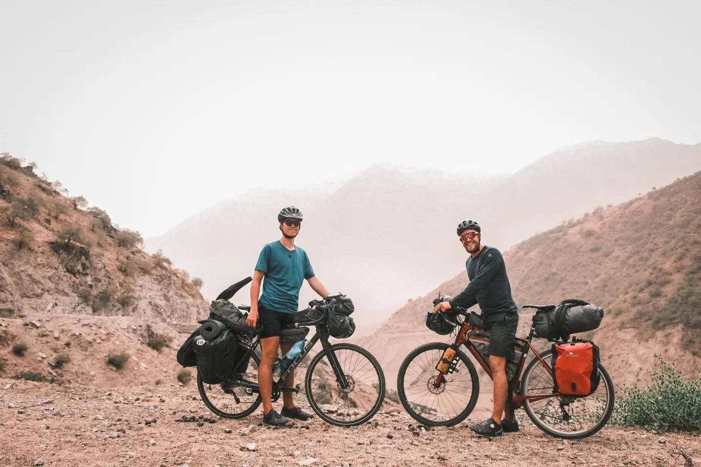 DAY 67 

In the land of Tajikistan,
Where mountains rise in grandeur,
And valleys stretch in mystic charm,
We wander lost in wonder.

The air is sweet with fragrance rare,
Of rose and jasmine bloom,
And in the distance, towering high,
The Pamirs loom