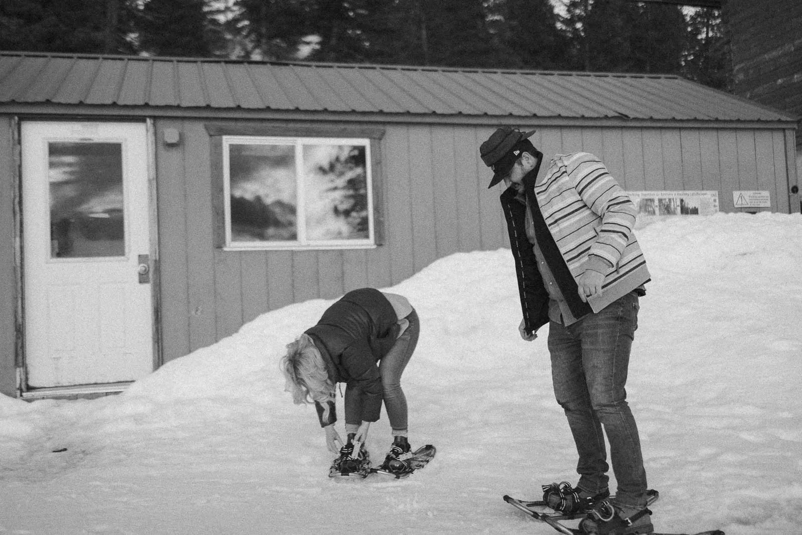  Boise couples straps into snowshoes as they begin their unique engagement adventure. 