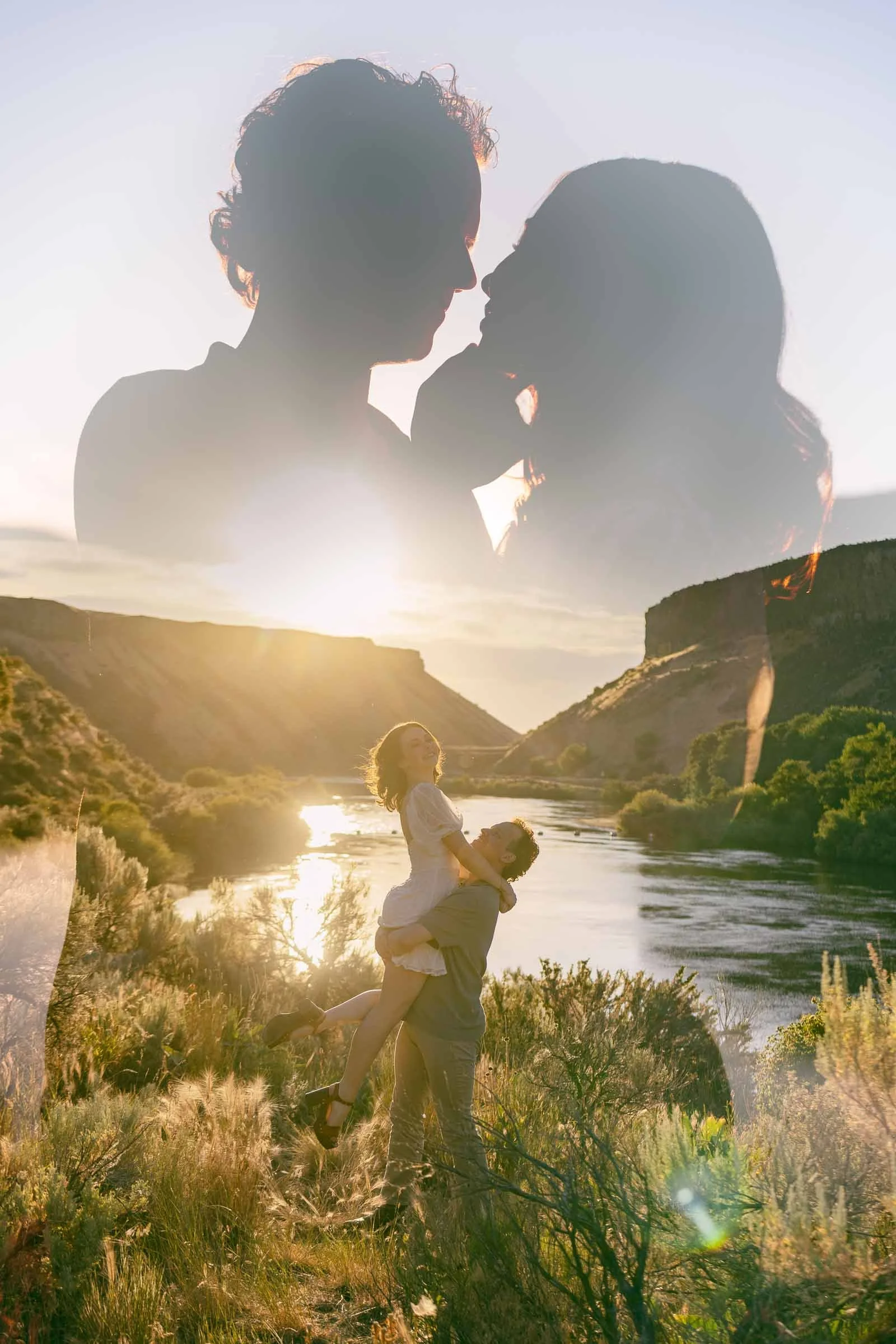  A double-exposure image of a couple silhouetted against a bright sky, layered over a scene of a man lifting a woman in his arms by a river at sunset. 