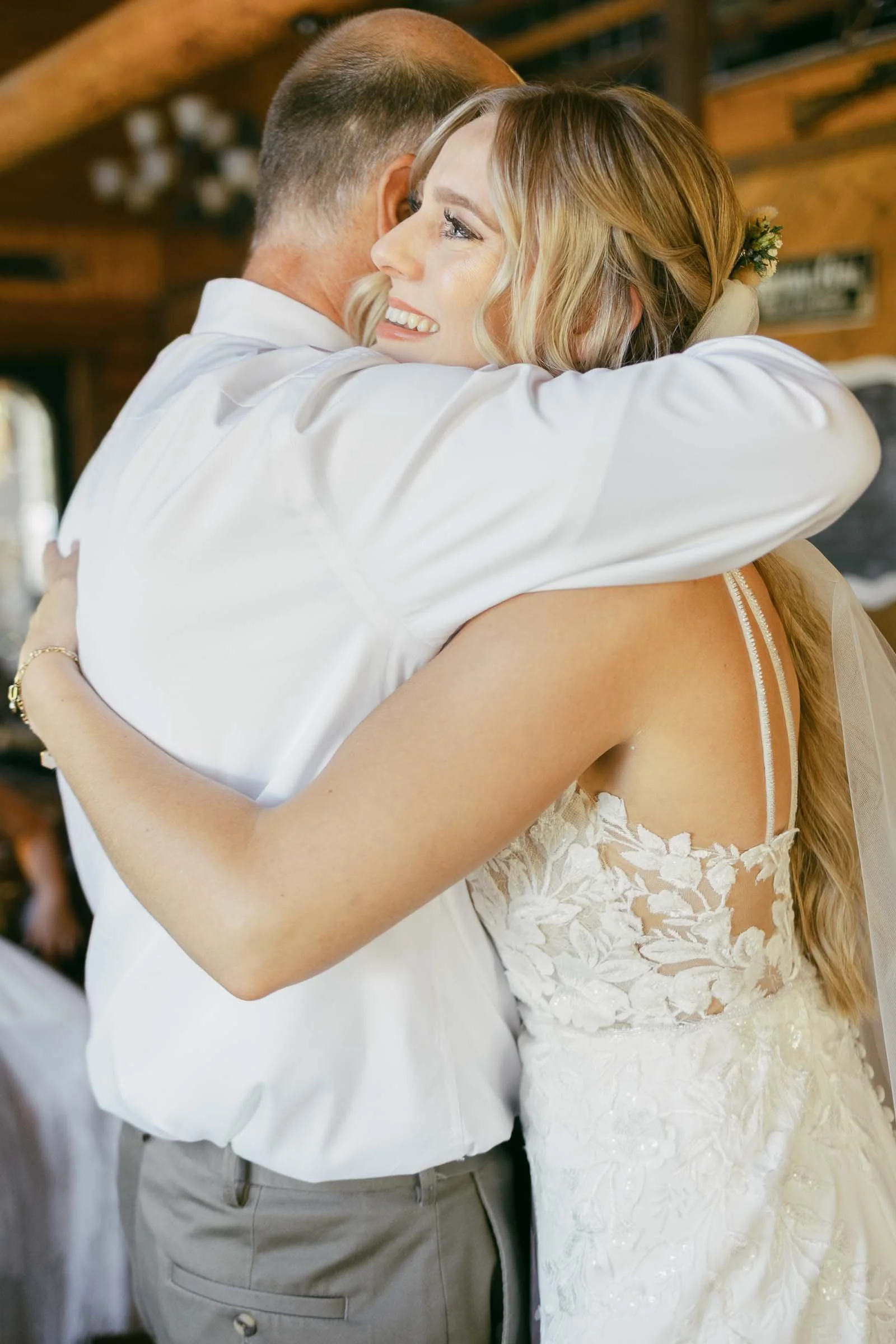 bride hugs her dad the final time before the ceremony begins