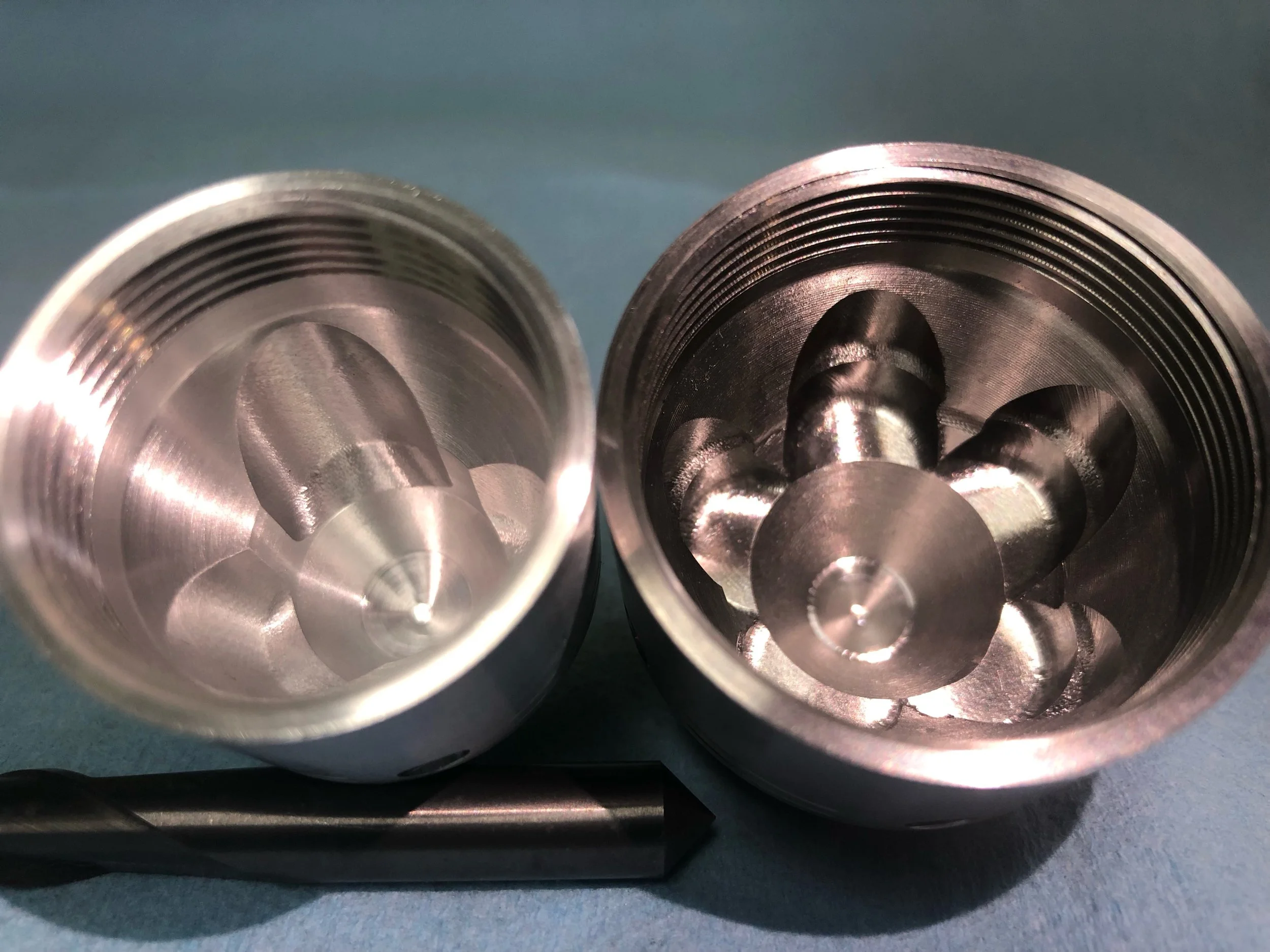 Lightening cuts on the inside of each cup.   This leaves a space where the spanner holes can go.