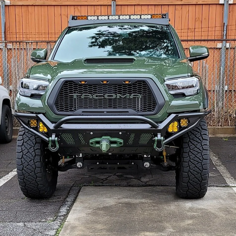 Front bumper in satin black. Also D rings in green and black with other pieces up front in green. #tacoma #toyota #bumper #offroad #powdercoating #4x4