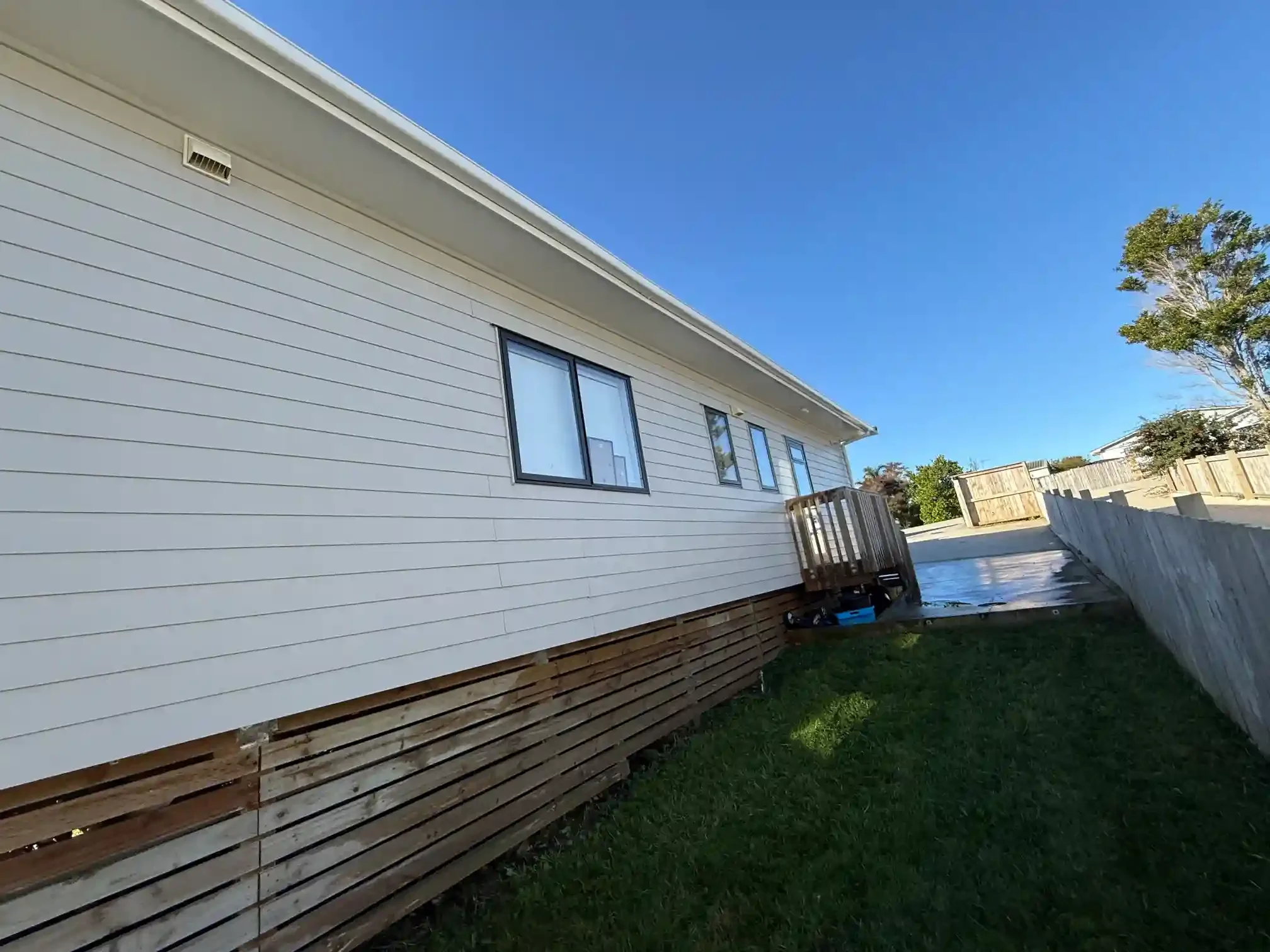 House washing completed in Point Chevalier Auckland, showing exterior cladding cleaned from dirt and buildup by Squeegee Boys..webp