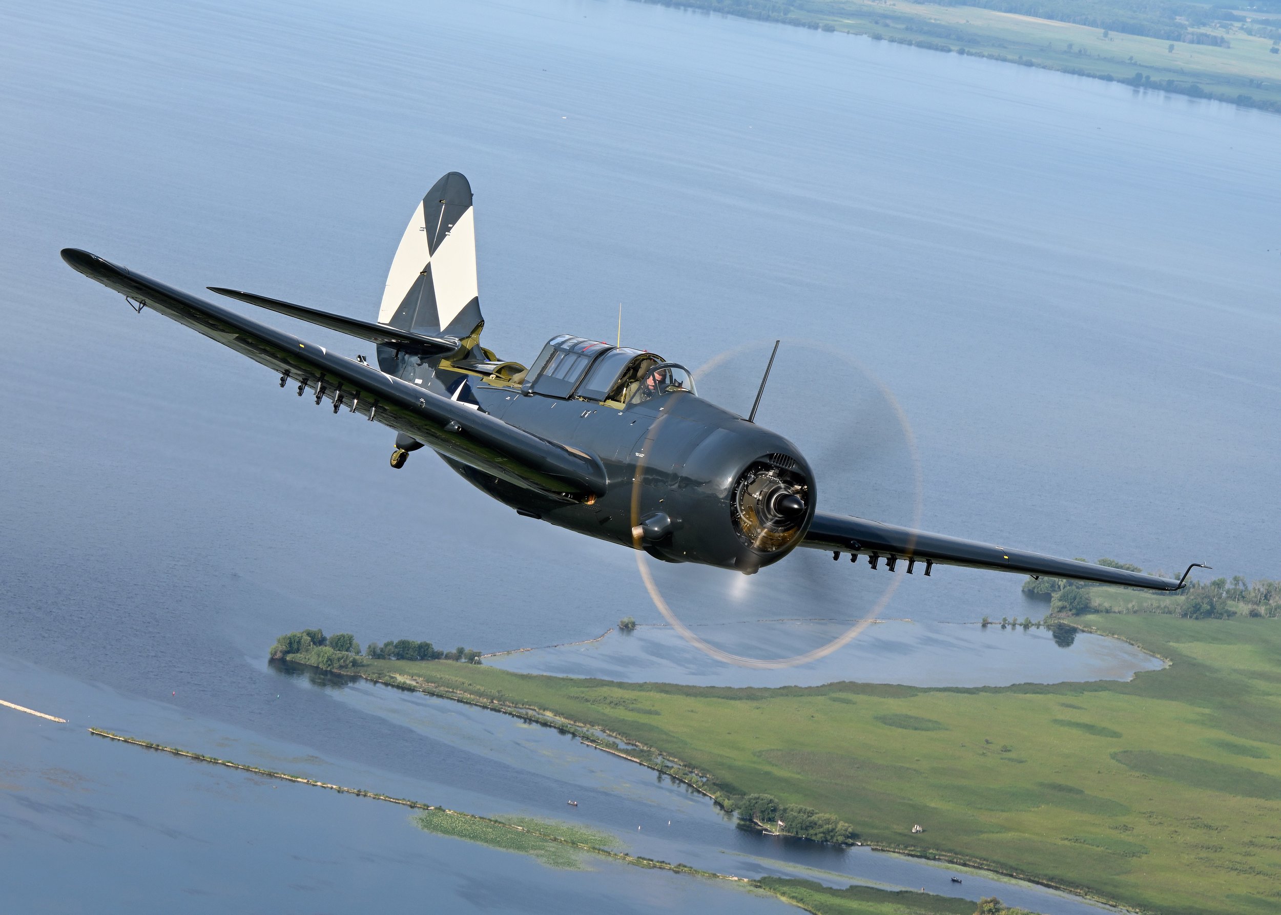 Curtiss Helldiver Flying Over Water_Fagen Fighters Restoration