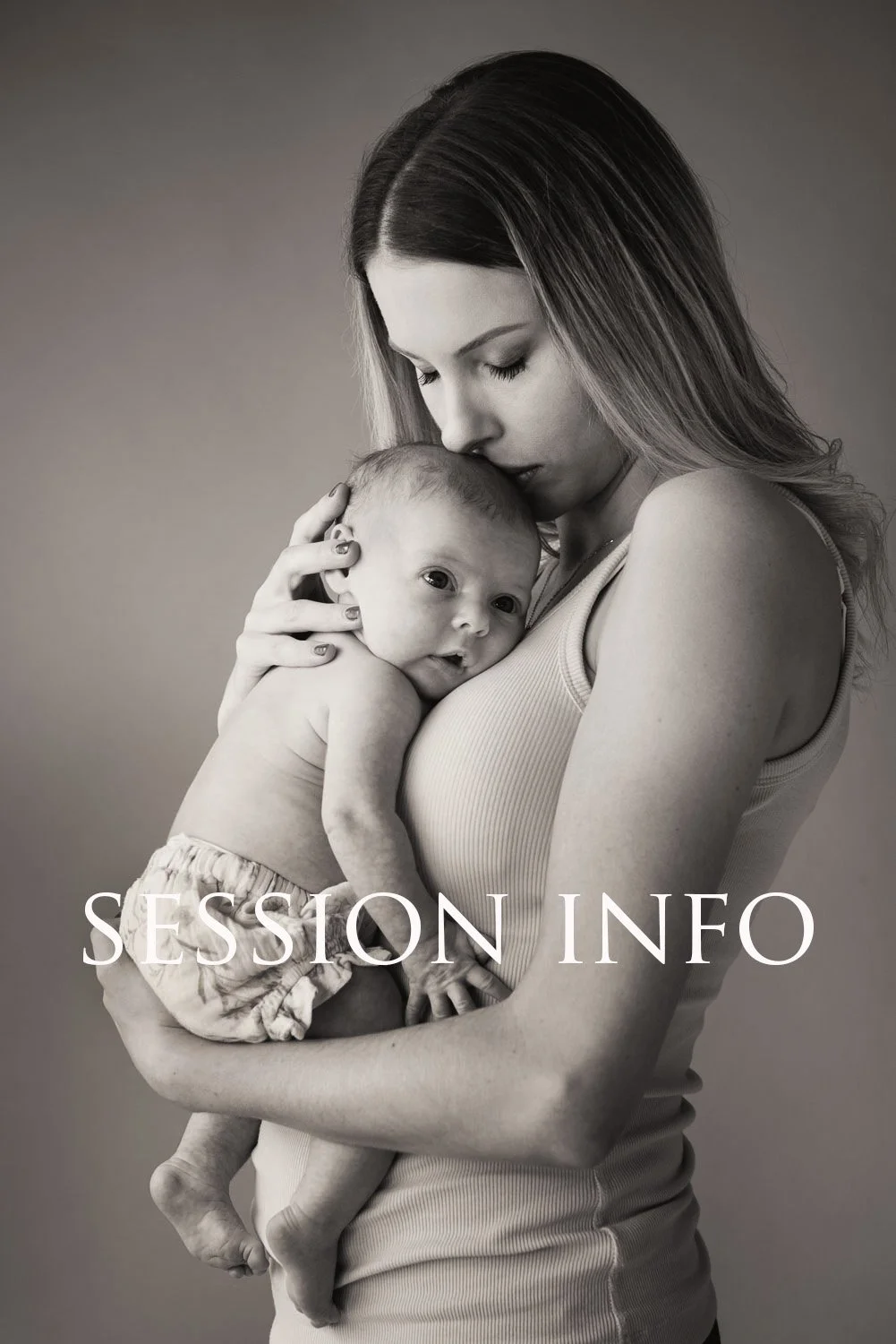 Black and white photo of a woman holding a baby close to her chest, with the woman gently resting her face on the baby's head. The text "SESSION INFO" is overlaid at the bottom.