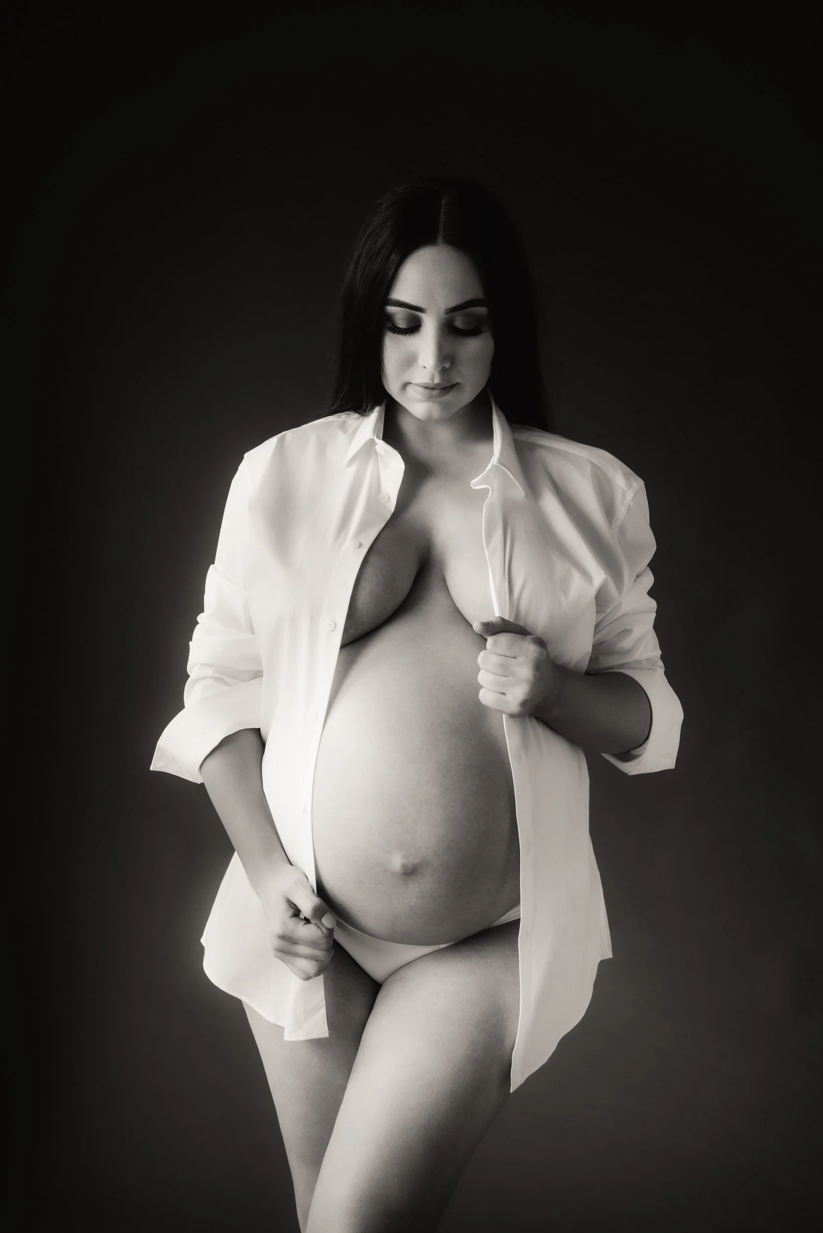 Pregnant woman wearing white shirt at a maternity photoshoot in Sydney