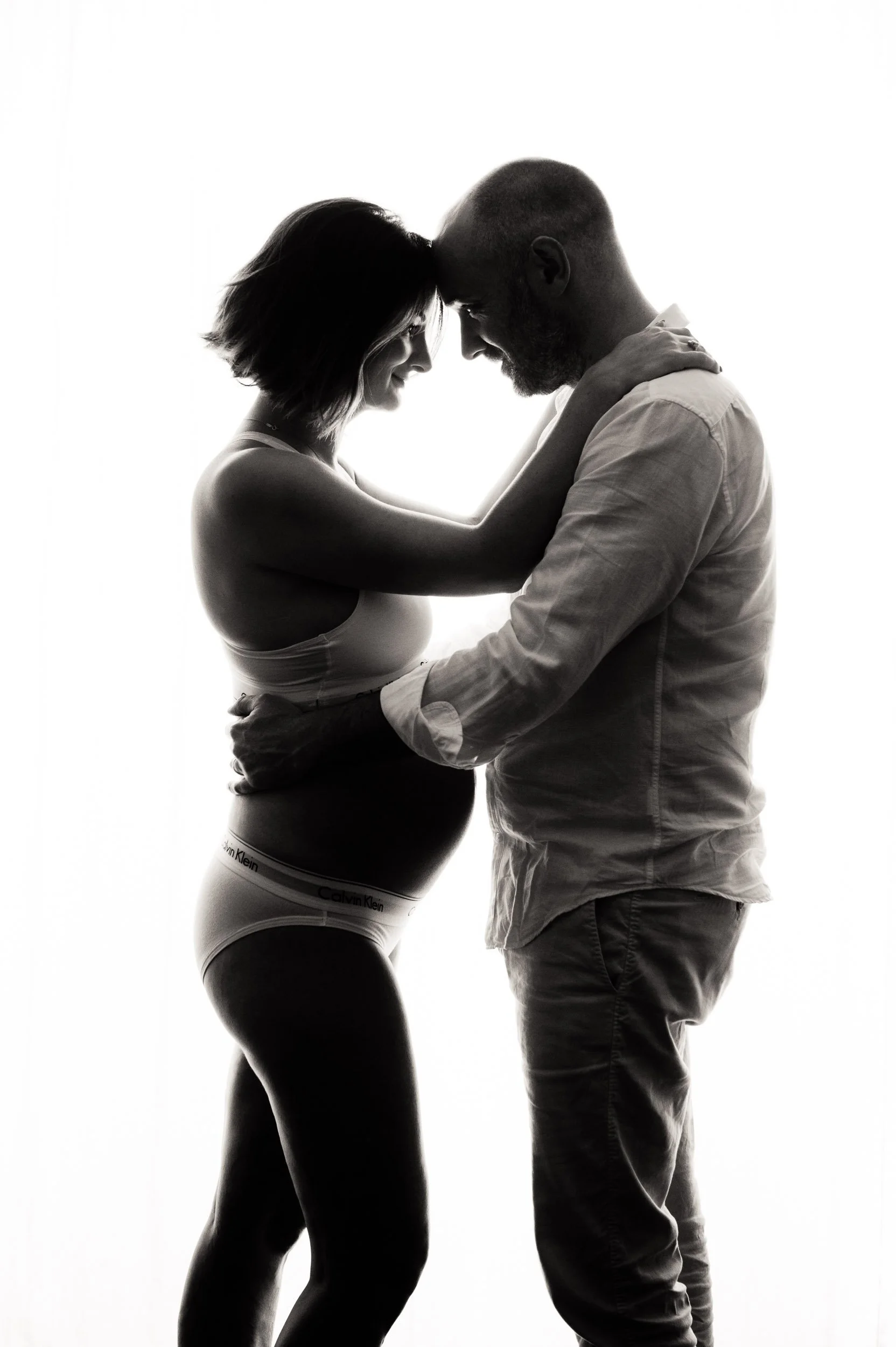 maternity photography Sydney session of couple hugging each other