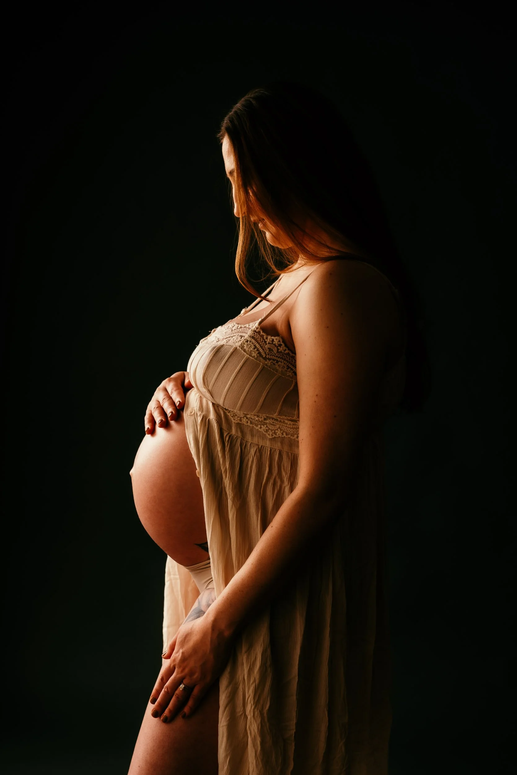 Maternity Photography of woman in lacey dress