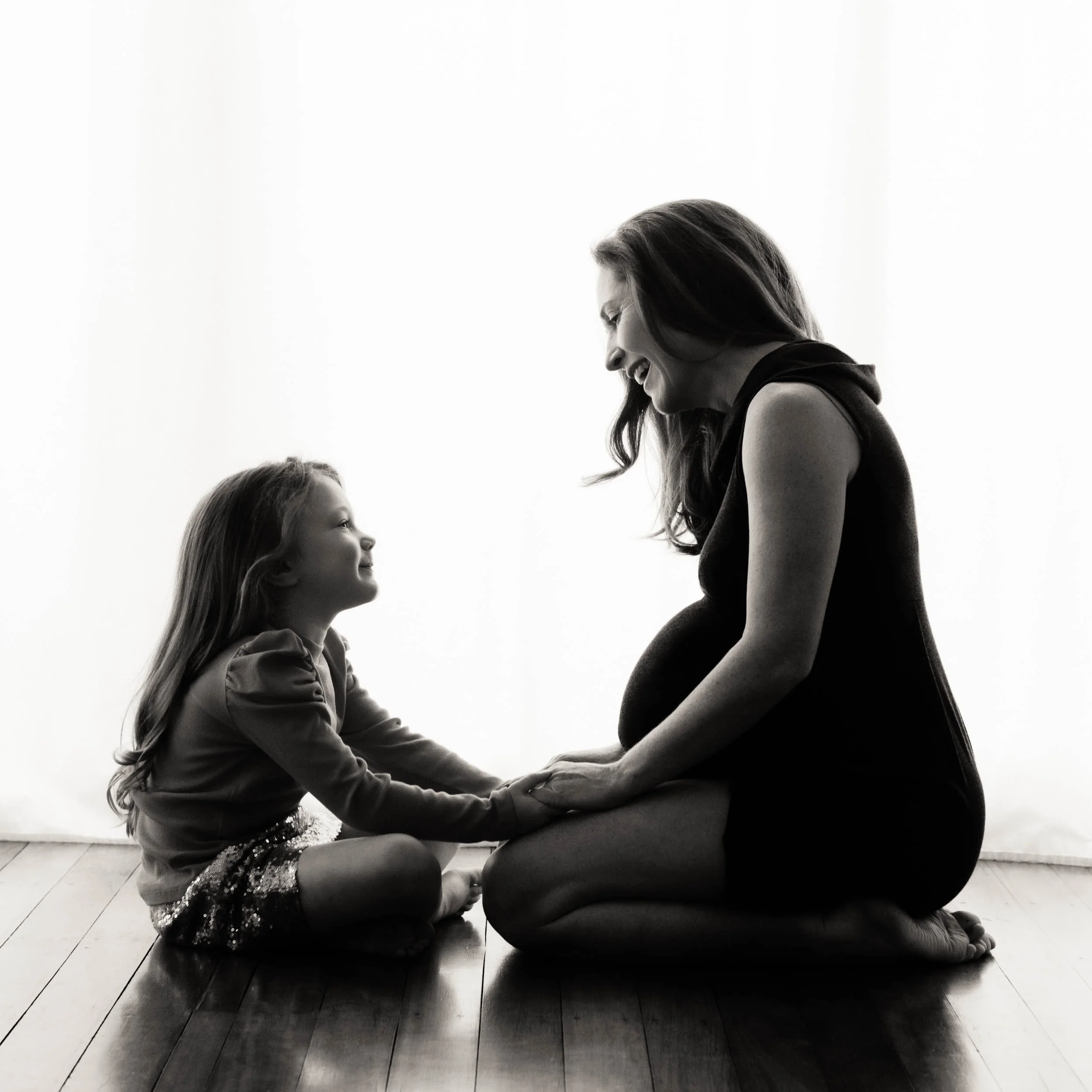 family pregnancy photography of mother and child laughing