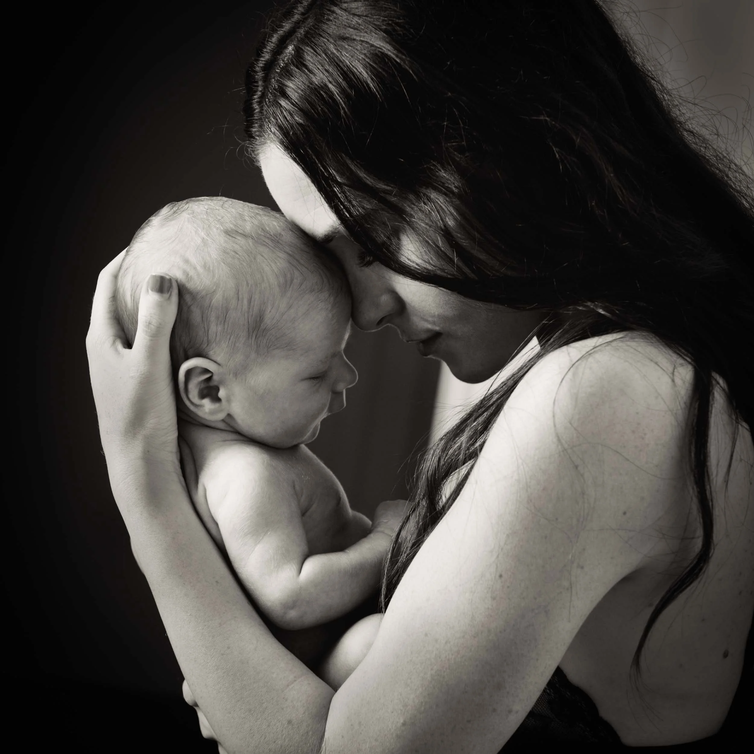 mother and cuddling during a newborn photography sydney session