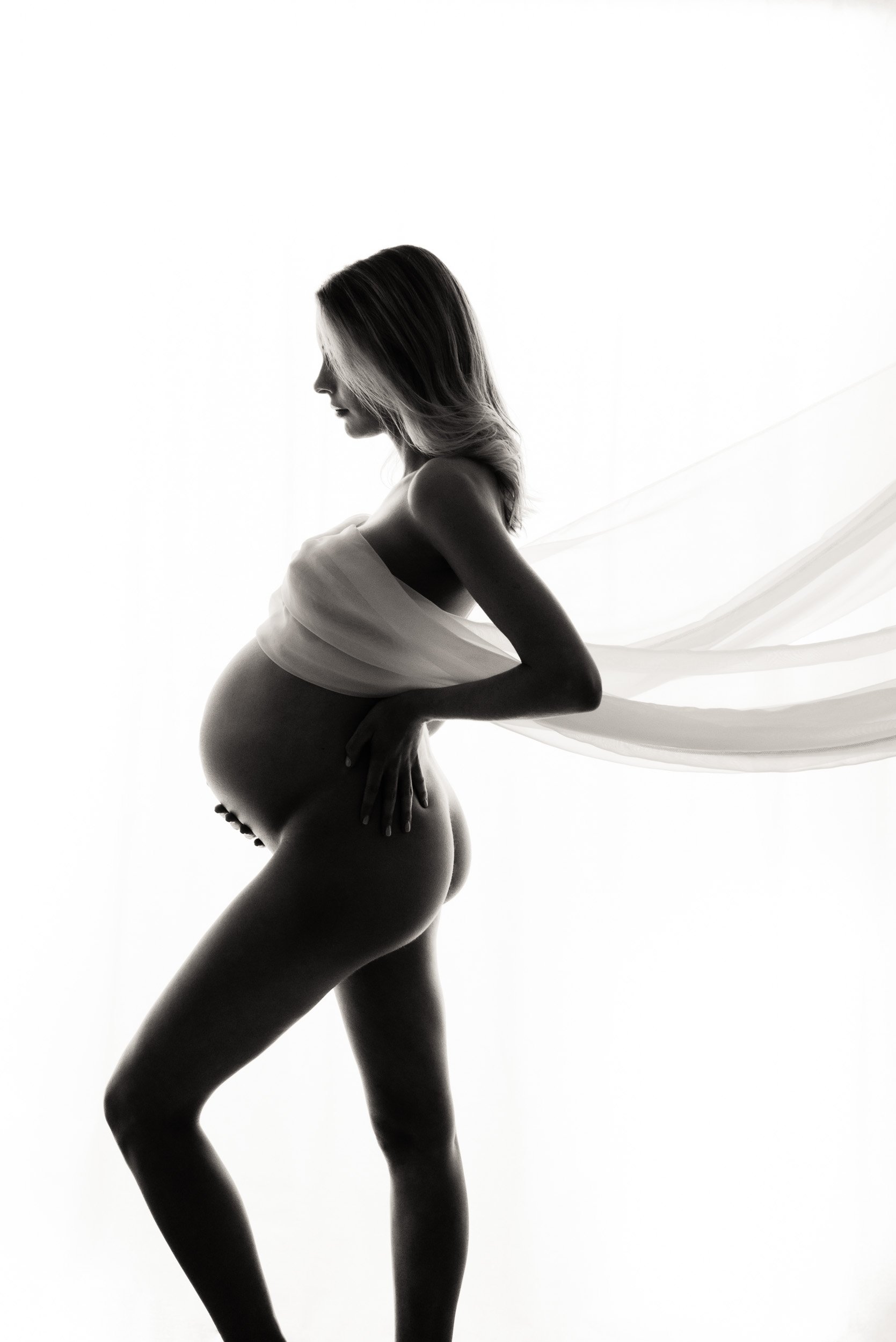 maternity photography Sydney shoot of woman with floating chiffon