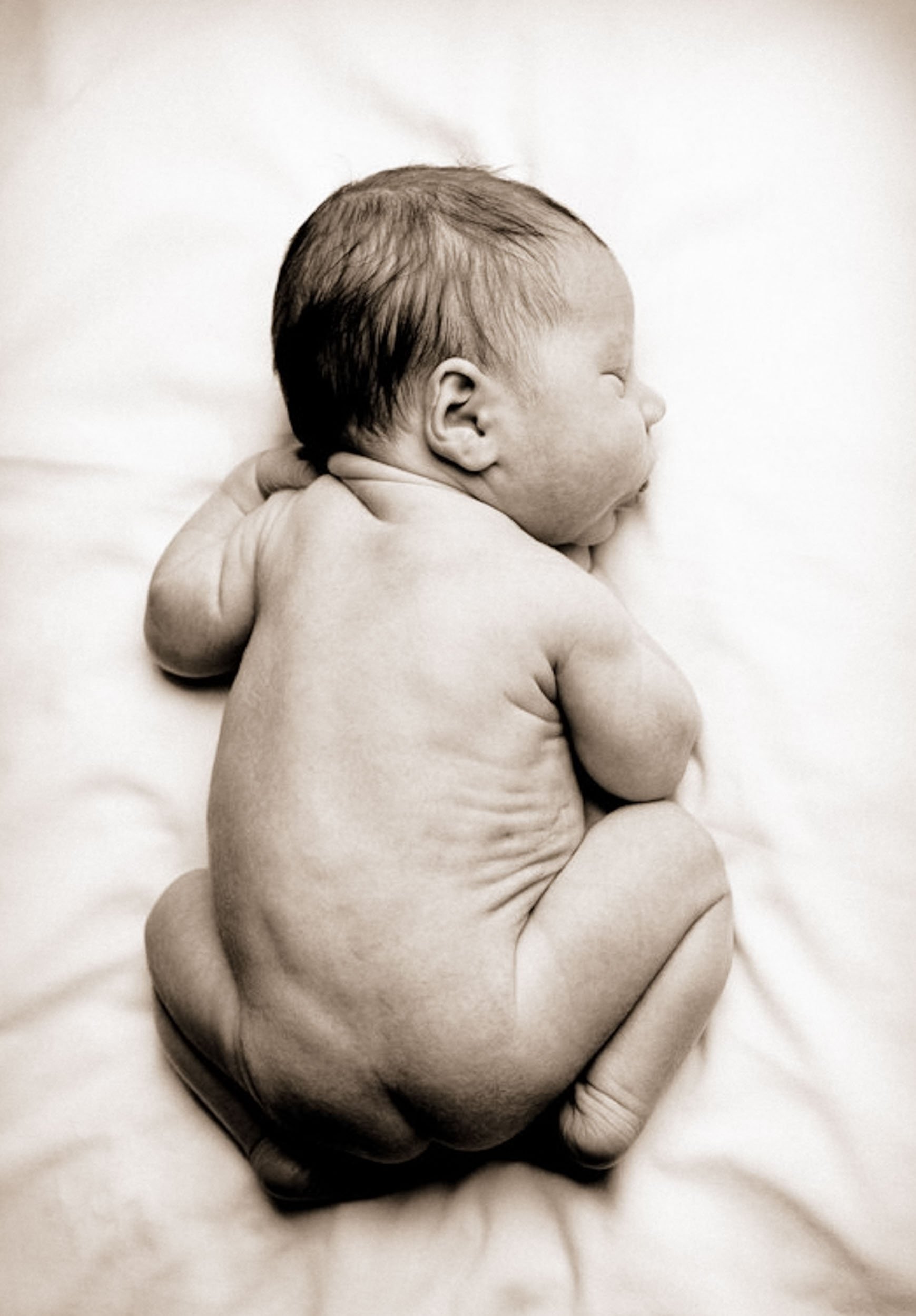 newborn sleeping on tummy