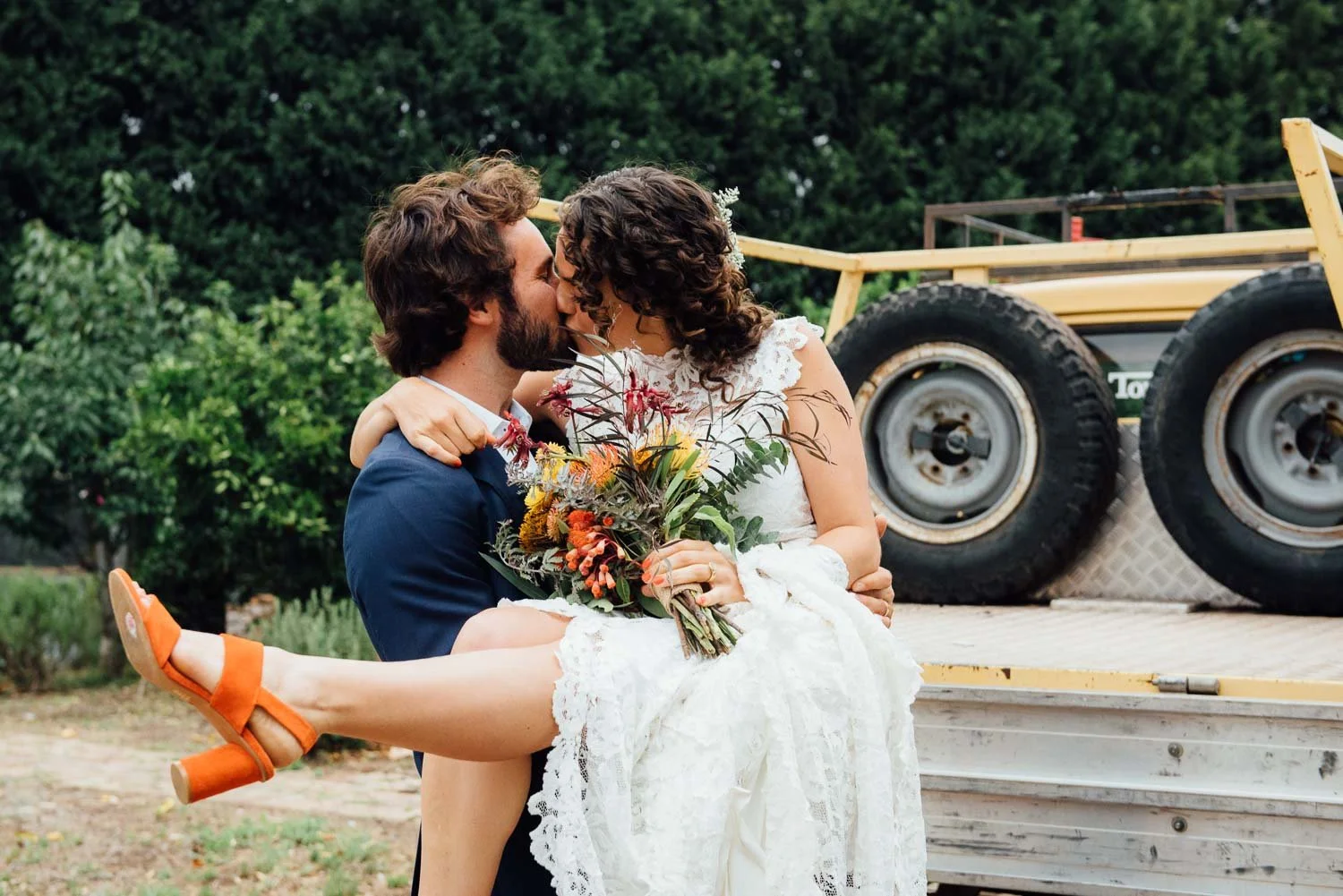 Relaxed wedding photo Northern Beaches Sydney, groom lifting bride while kissing