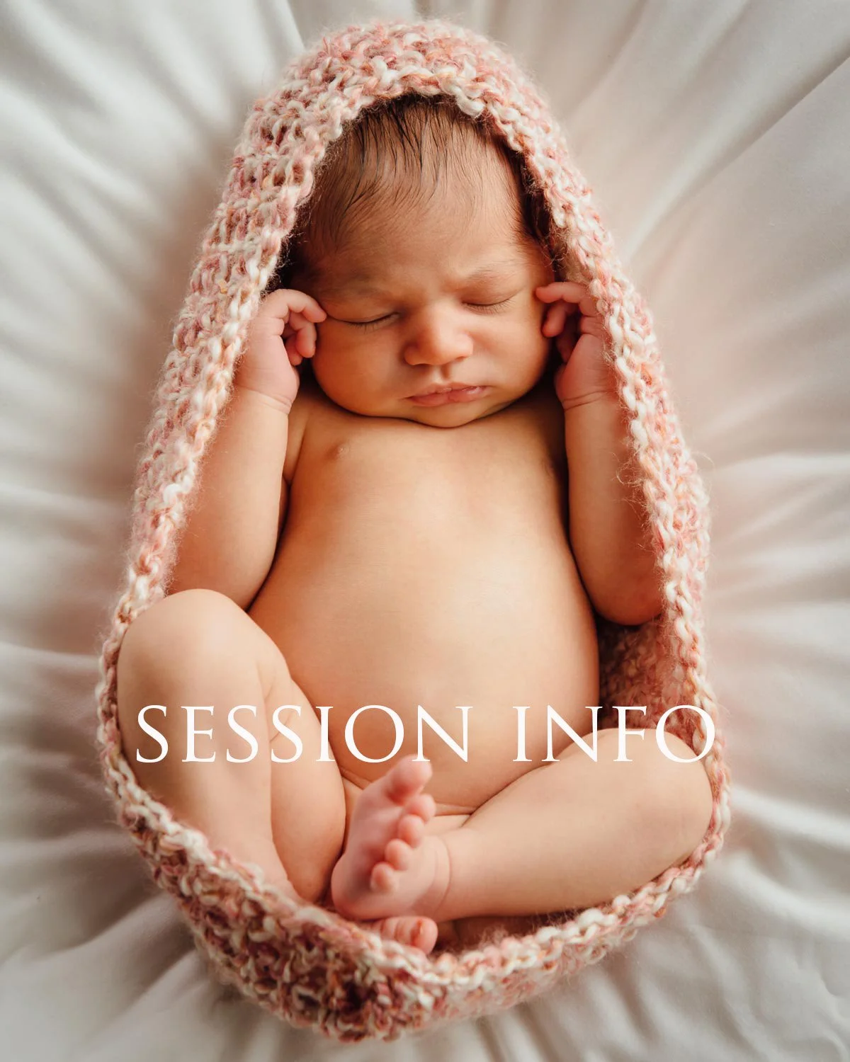 A sleeping newborn baby with a pink and white knitted hood on a soft white blanket, with the text 'SESSION INFO' overlaid.