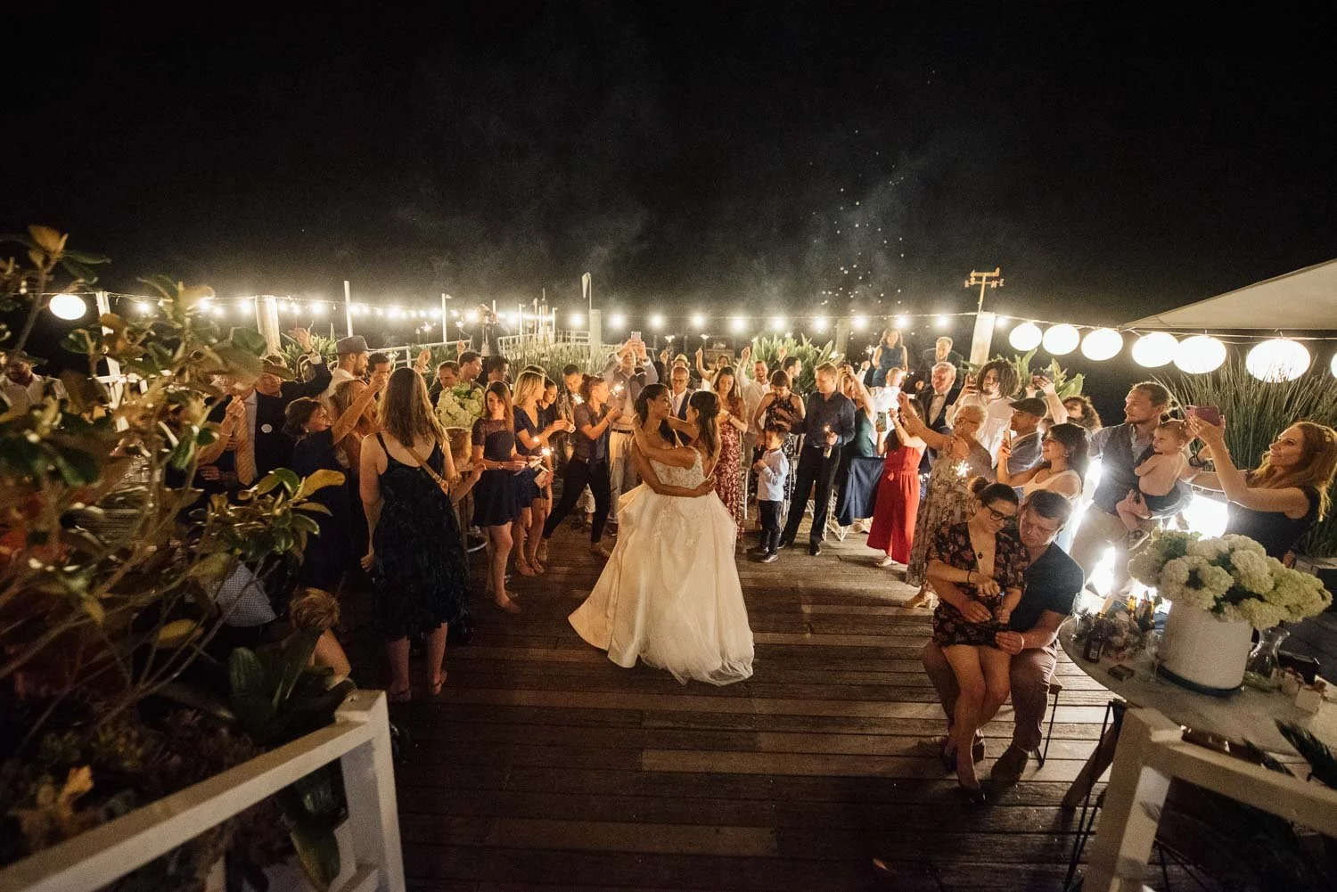 same sex couple two brides first dance at Boathouse wharf in Palm Beach
