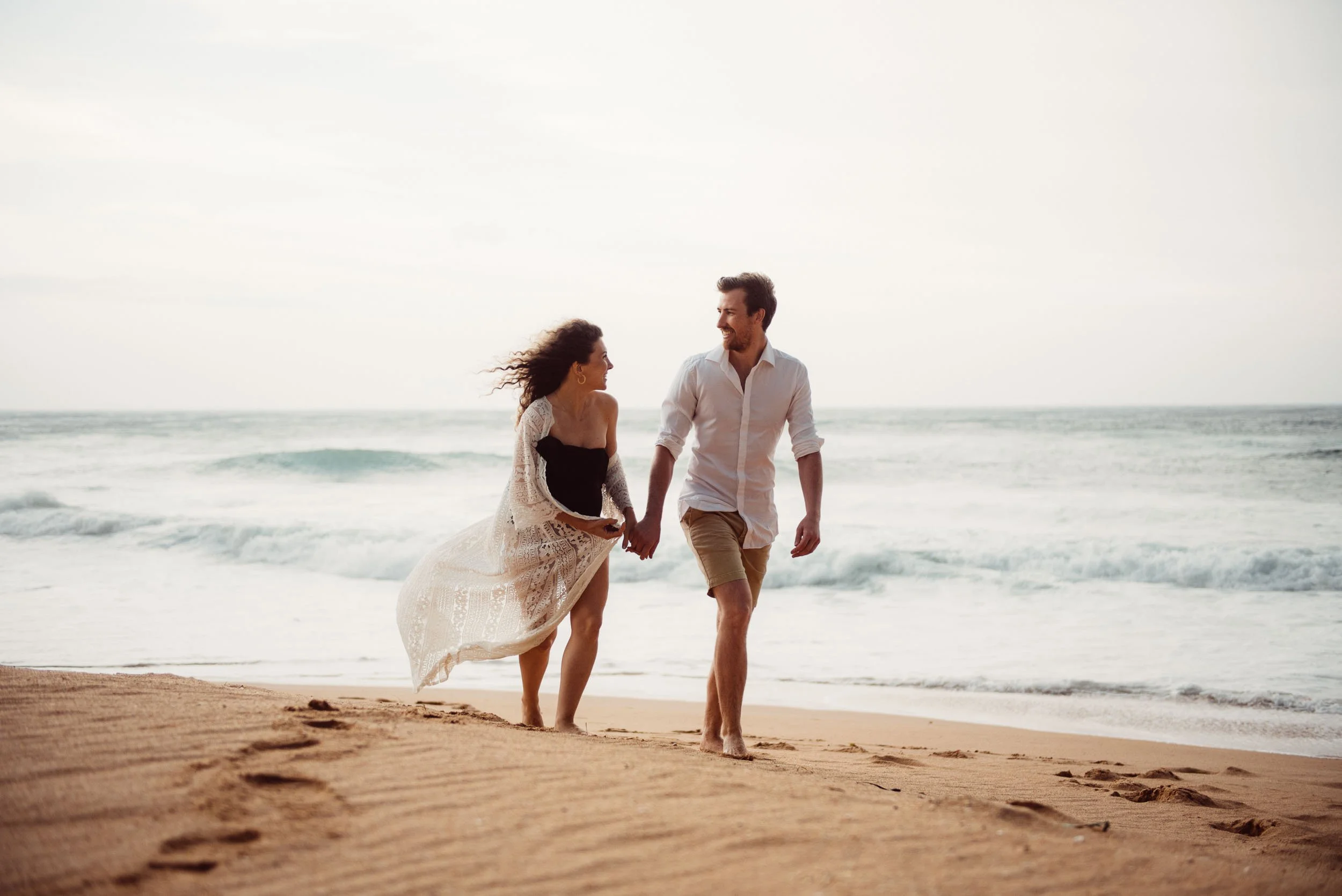 maternity photography beach shoot of couple on the northern beaches