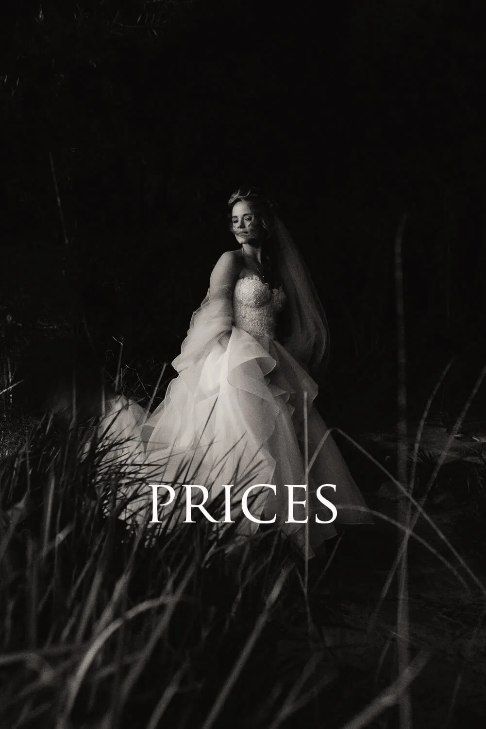 A woman in a wedding dress standing outdoors at night, surrounded by tall grass, with the word "PRICES" overlaid at the bottom.