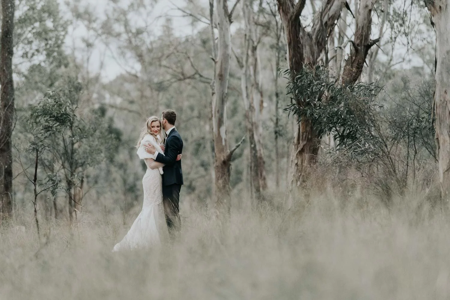 Wedding photo bride and groom in the bush with long grass and gum trees Hunter Valley