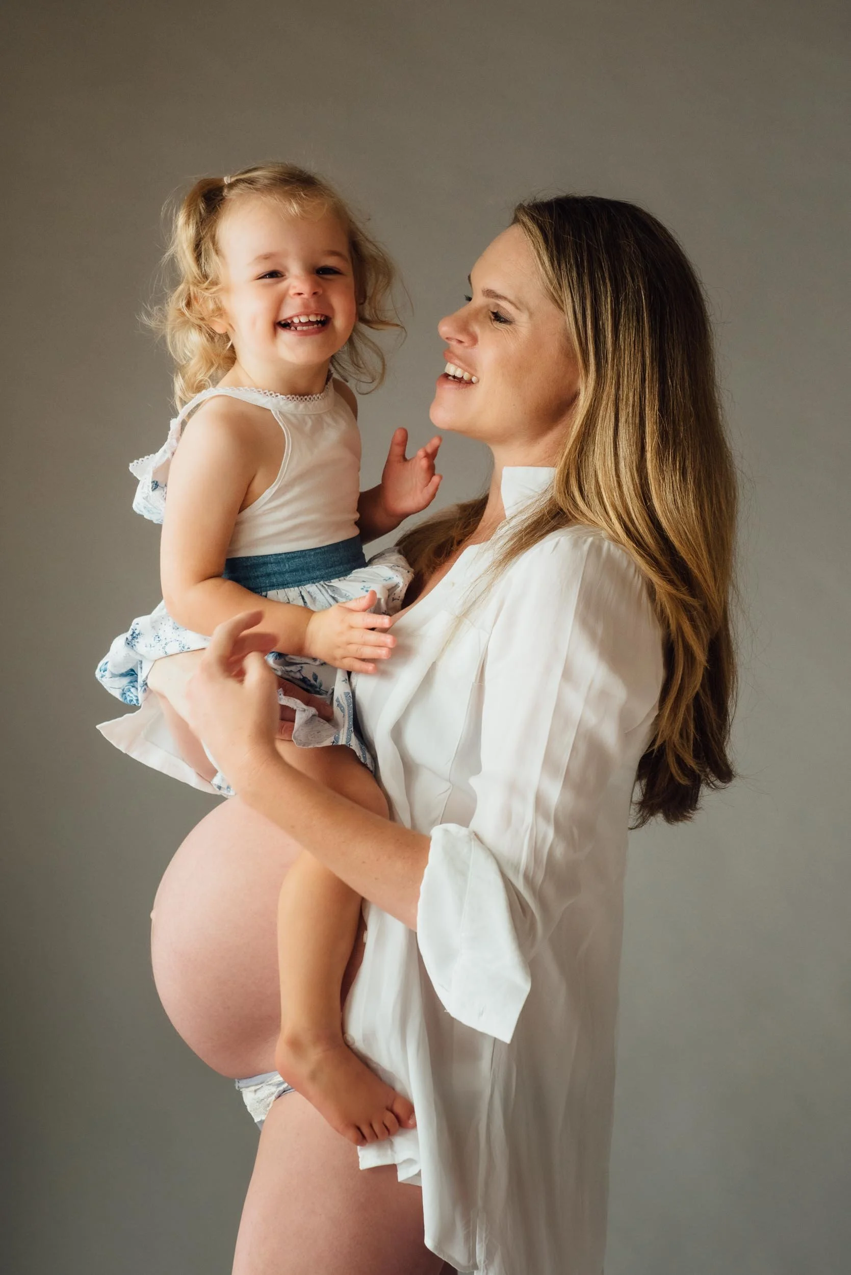 family maternity photography Sydney shoot of mother and daughter laughing