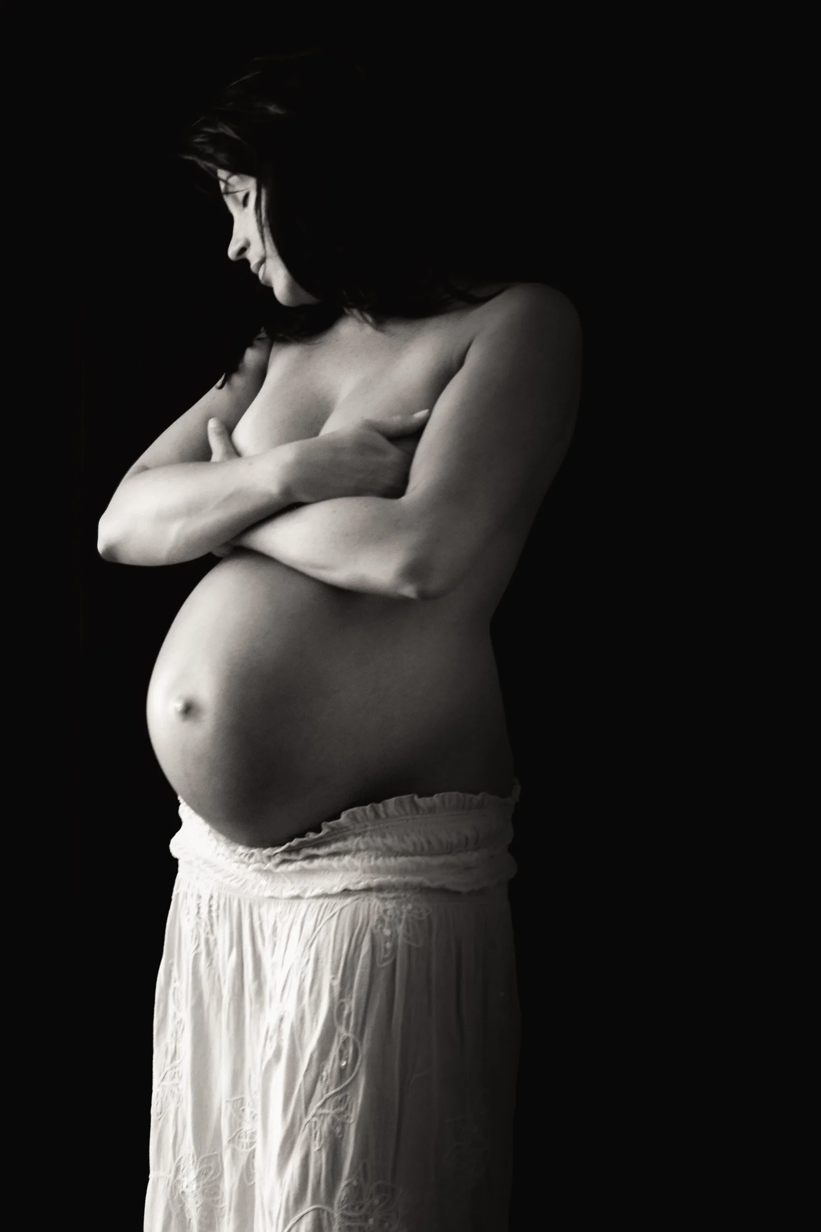 artistic maternity photography of a woman.