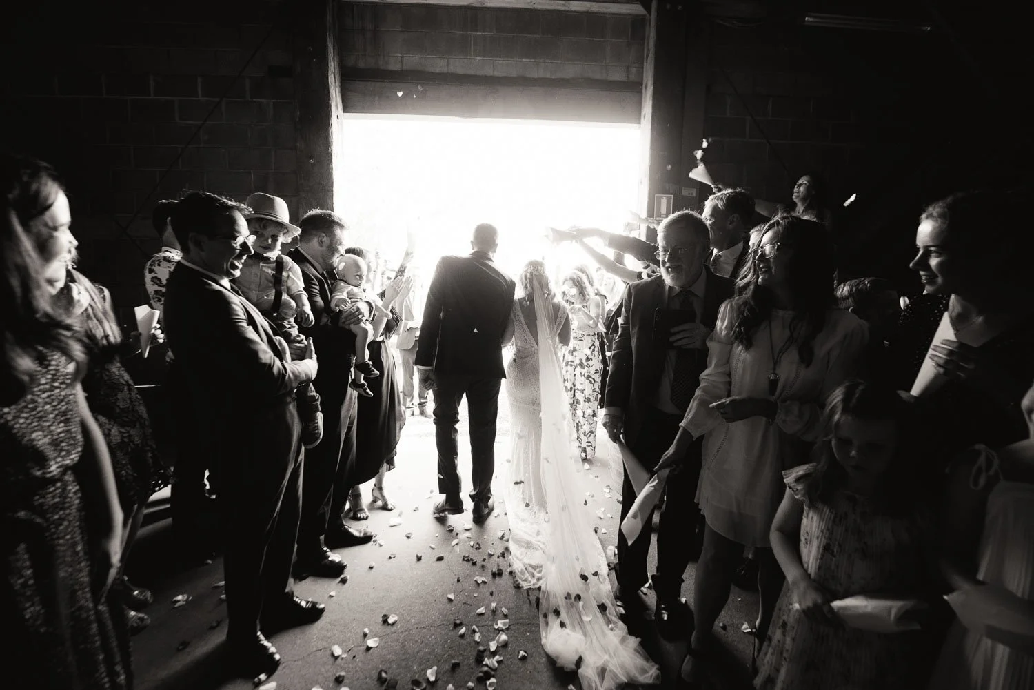 Hunter Valley barn wedding ceremony, black and white bride and groom walking out of barn