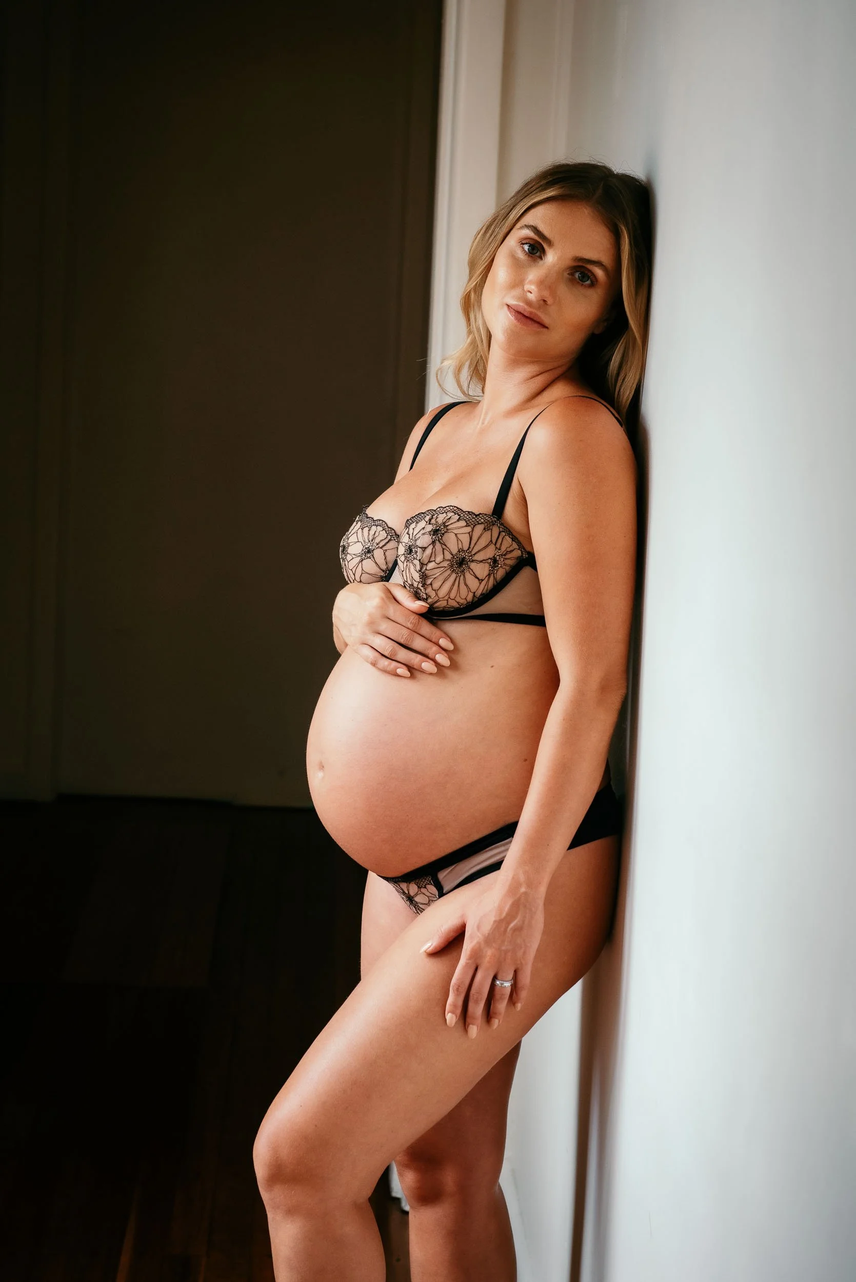 Maternity Photoshoot of woman wearing black lingerie