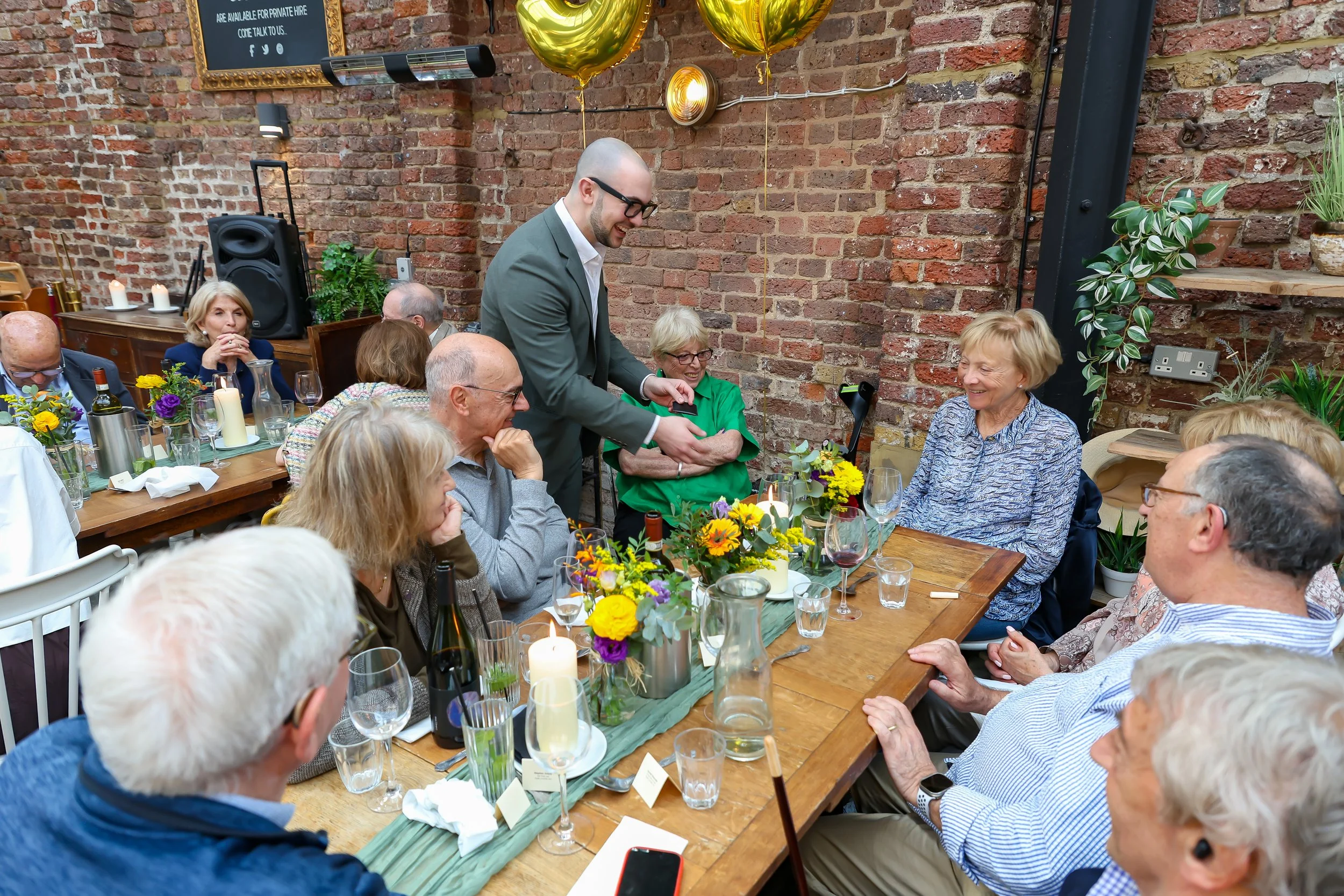 Magician do his mingling tricks to the guests. 2026-May 3 Rhoda & Baruch Golden Anniversary. 